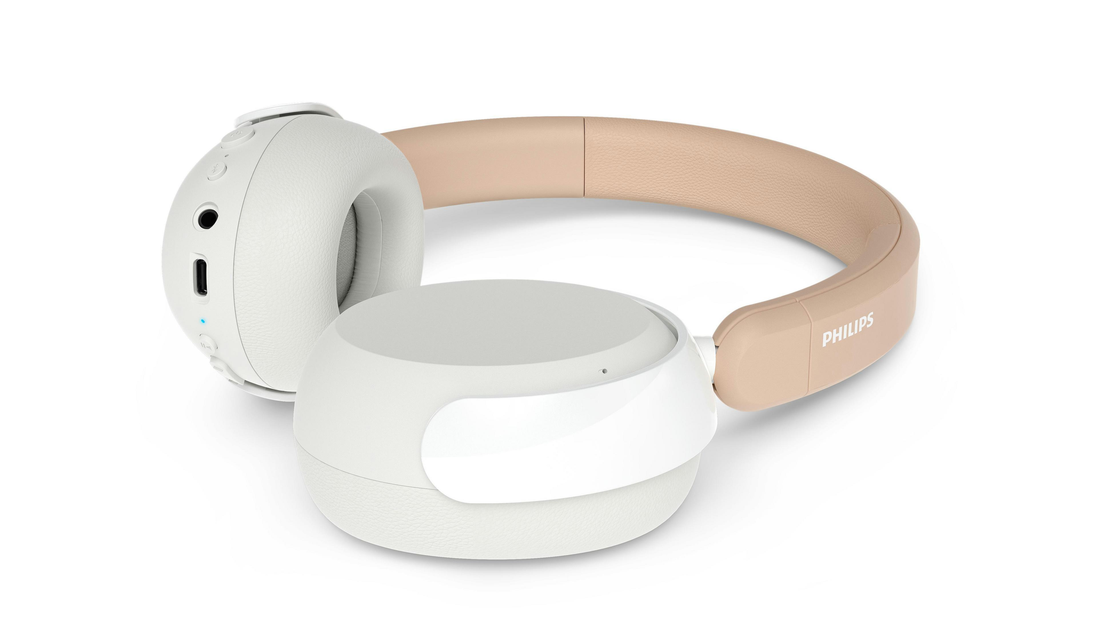 Cuffie Philips bianche e beige con archetto e padiglioni su sfondo bianco.