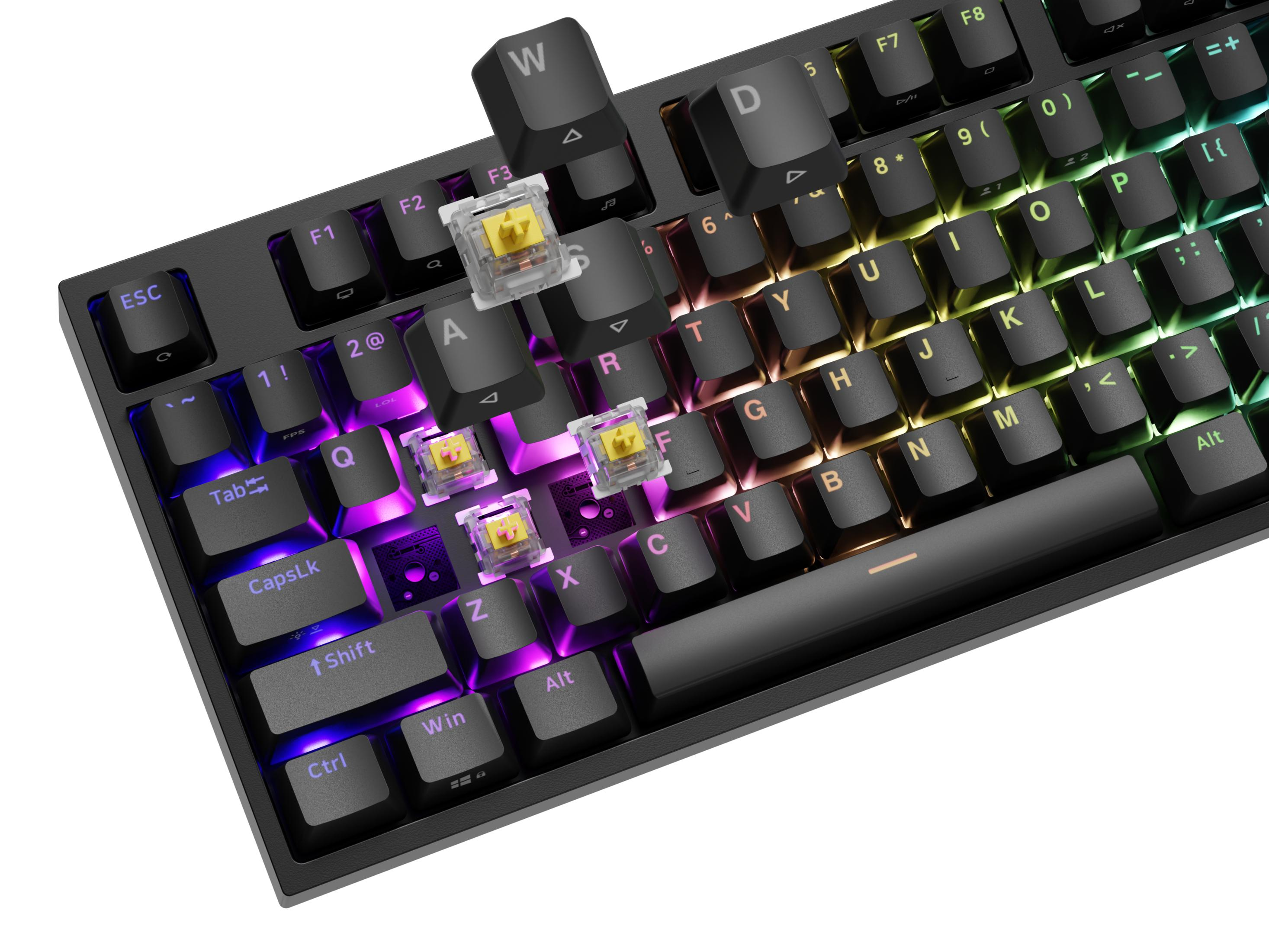 Un primo piano di una tastiera meccanica nera con illuminazione RGB e copritasti rimossi.