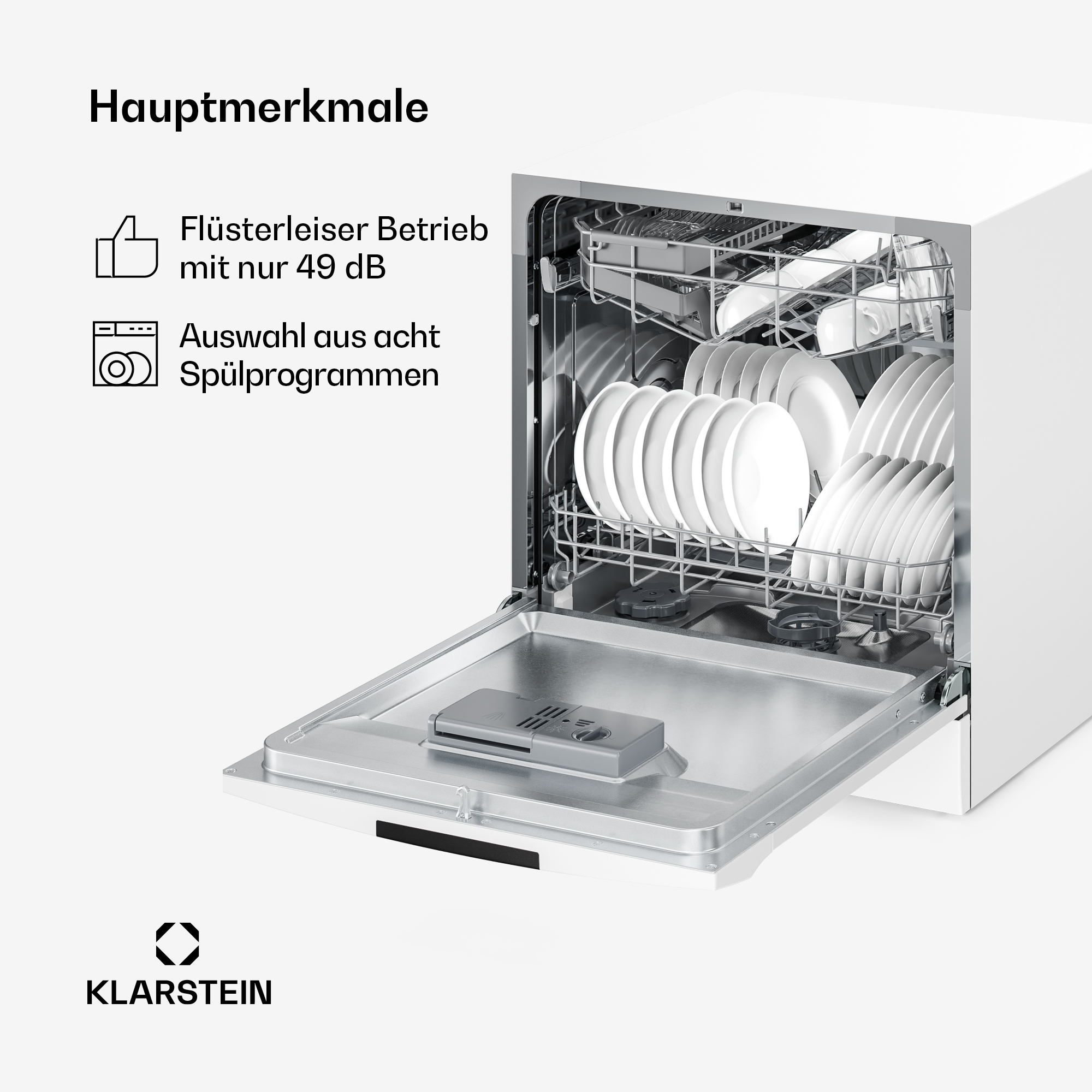 Un lavavajillas Klarstein blanco abierto con estantes llenos de platos y tazas.
