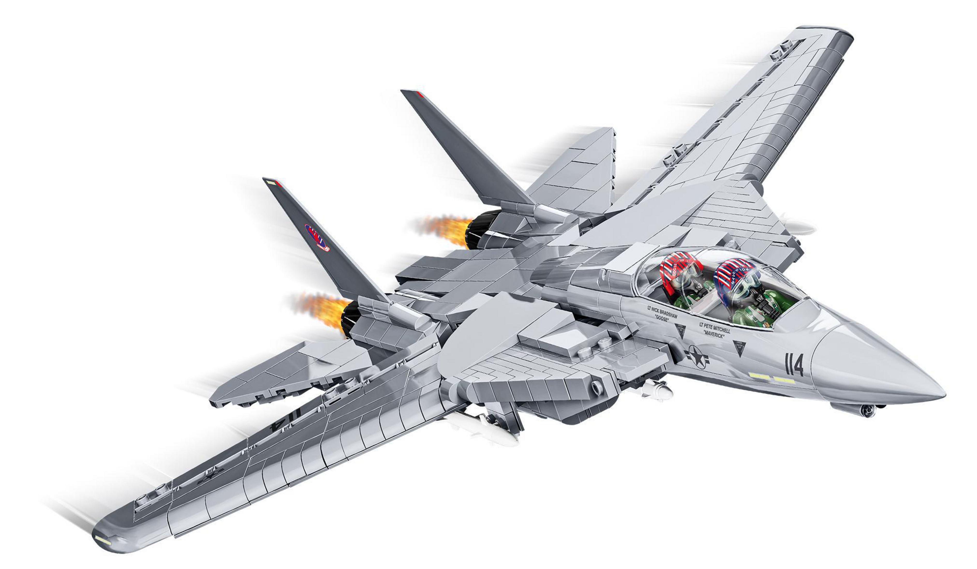 Un jet Lego grigio con due piloti nella cabina vola con fiamme dai motori.