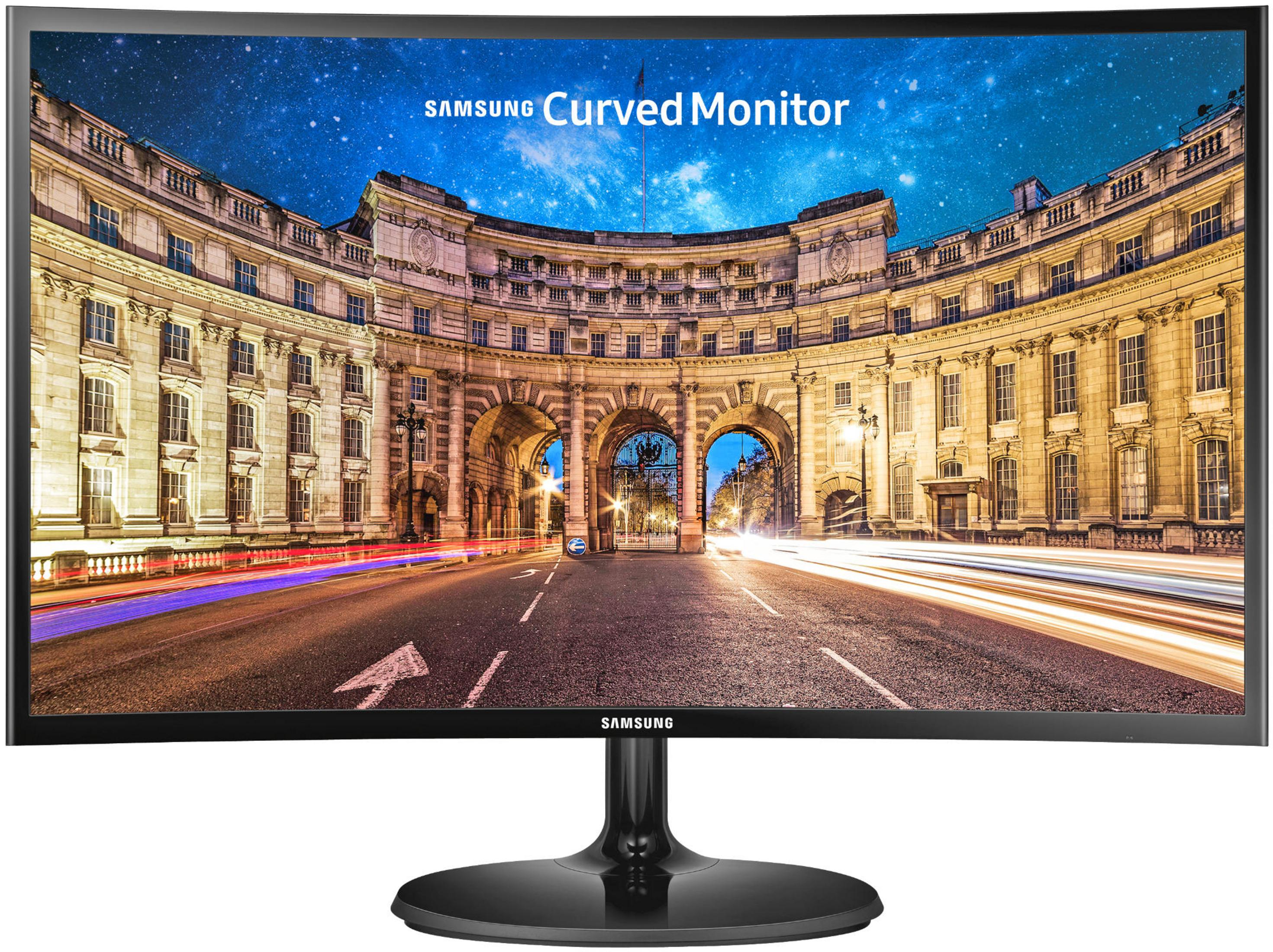 Un monitor curvo Samsung mostra una scena notturna di strada con scie luminose.