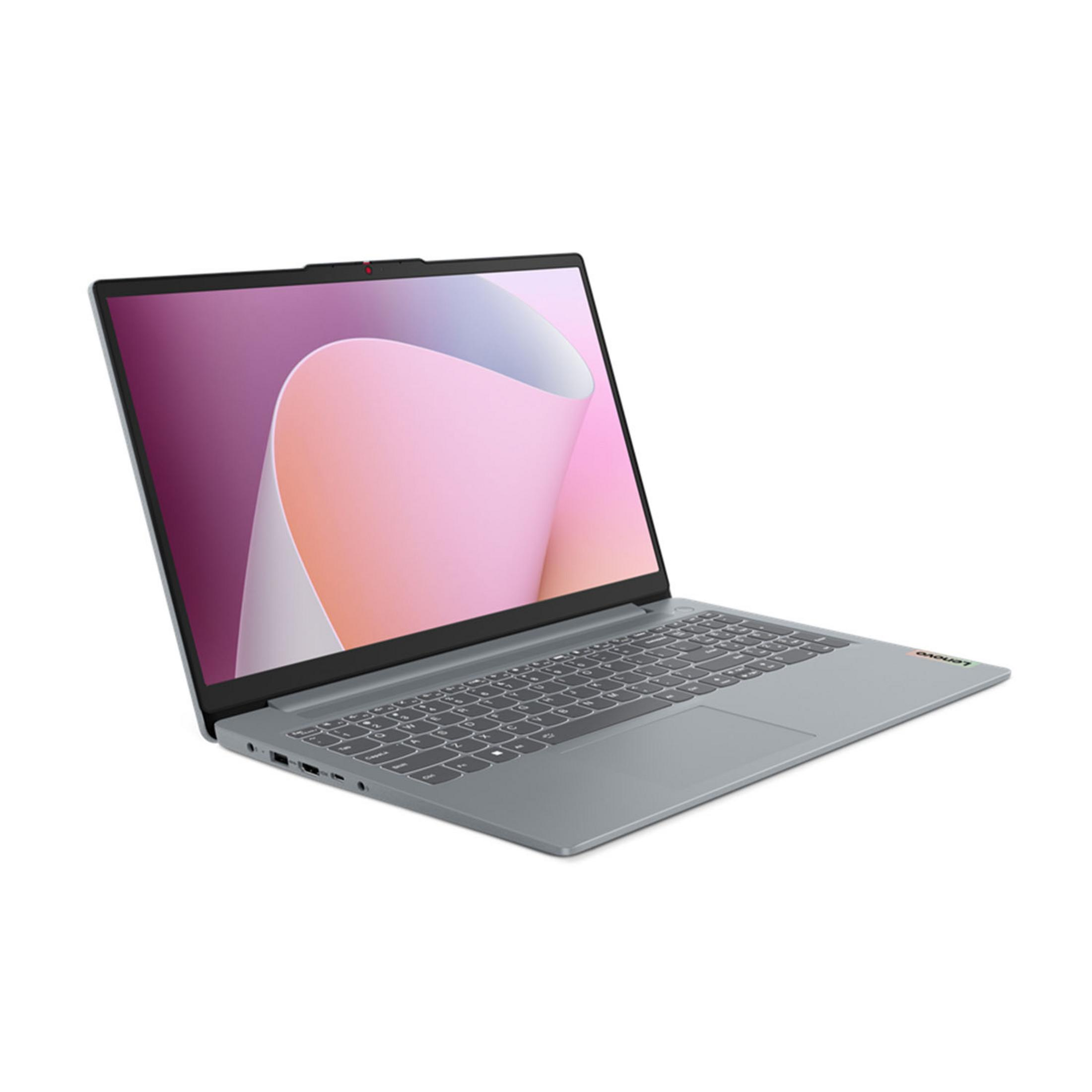 Un laptop Lenovo grigio è aperto, con uno sfondo astratto rosa e viola sullo schermo.