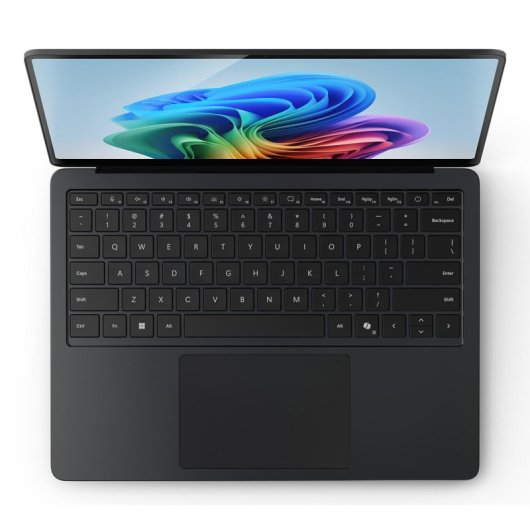 Ciemny laptop z otwartym ekranem, wyświetlający kolorowy wzór.