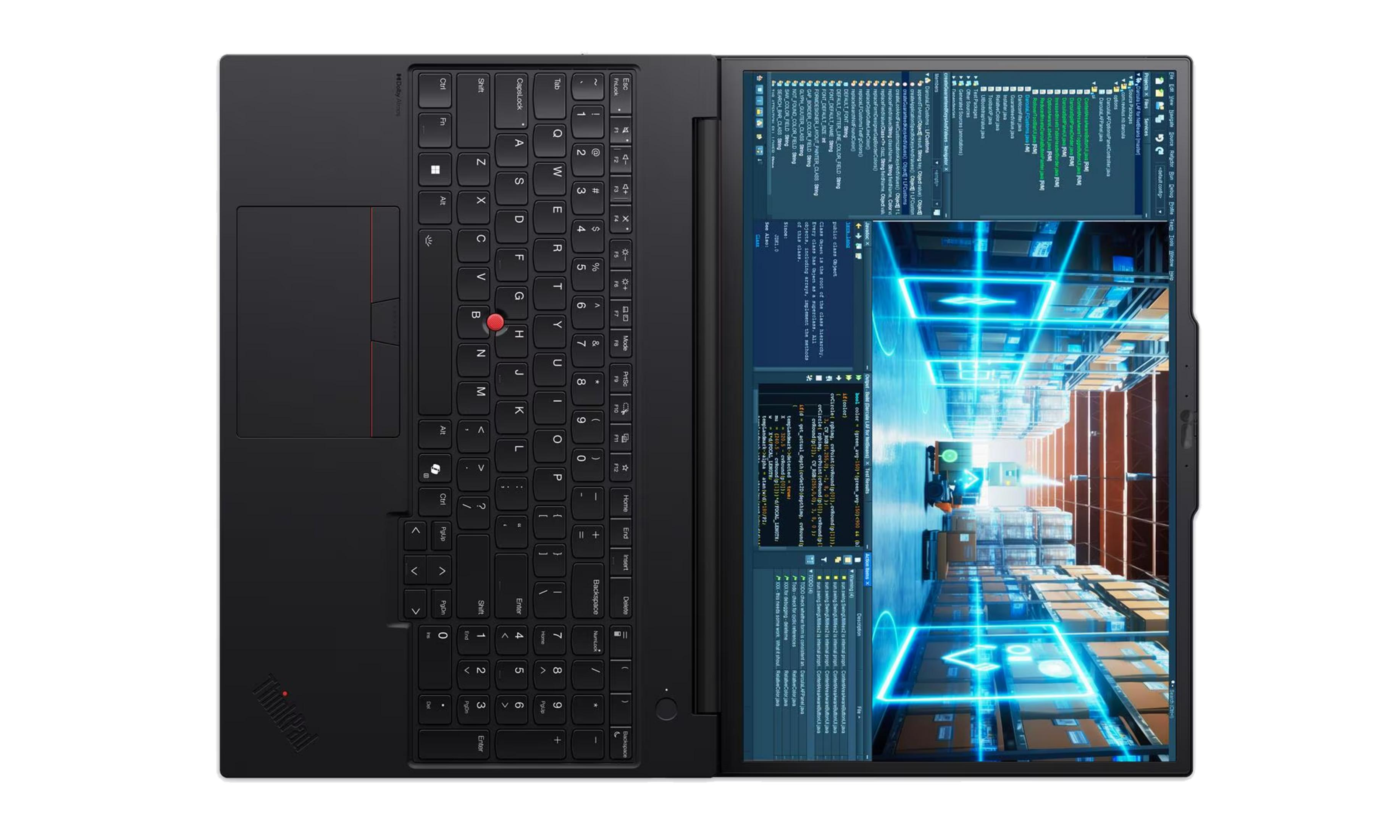 Un portátil negro abierto que muestra teclado y una pantalla con código y simulación de almacén.
