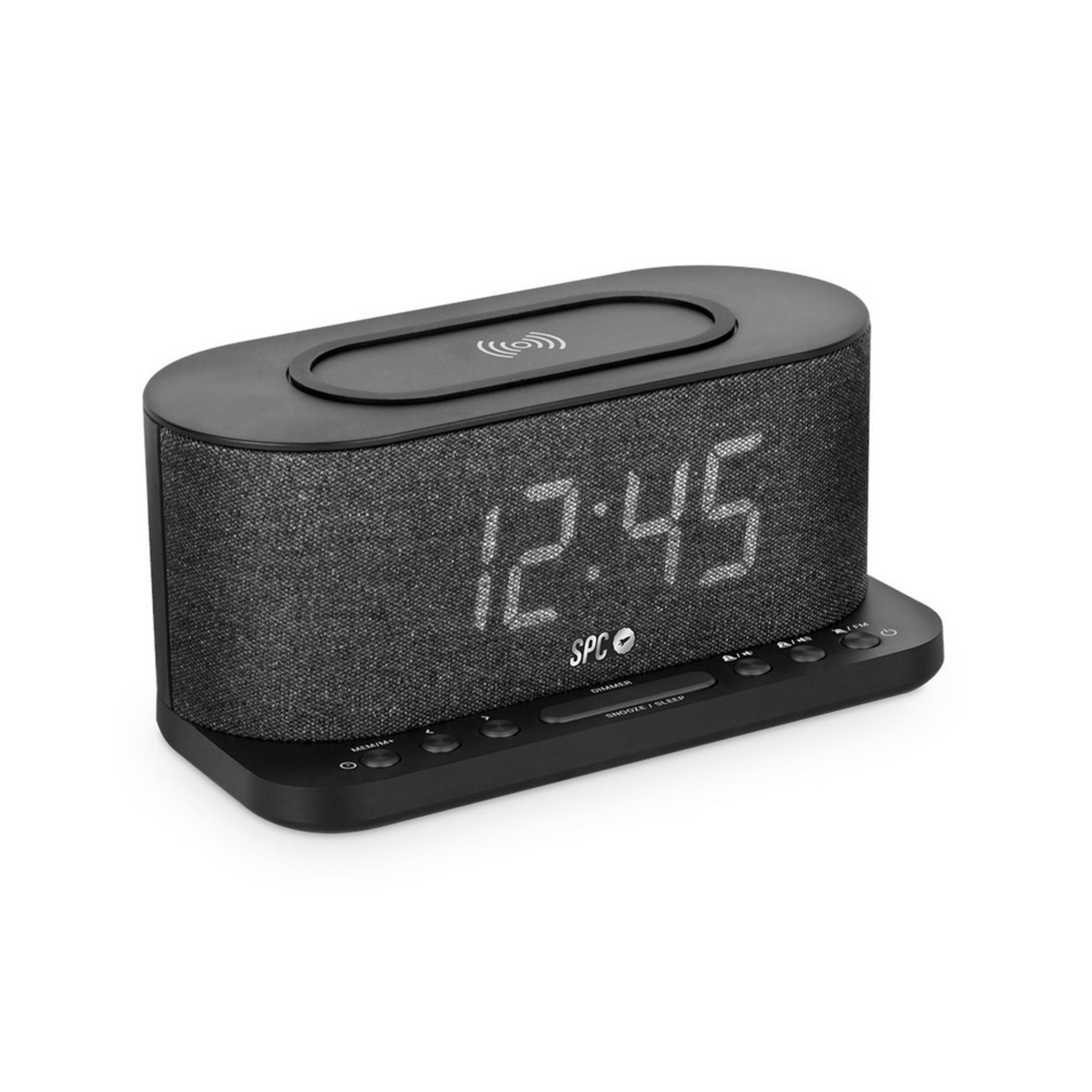 Un despertador negro con pantalla digital de 12:45 y base de carga en la parte superior.
