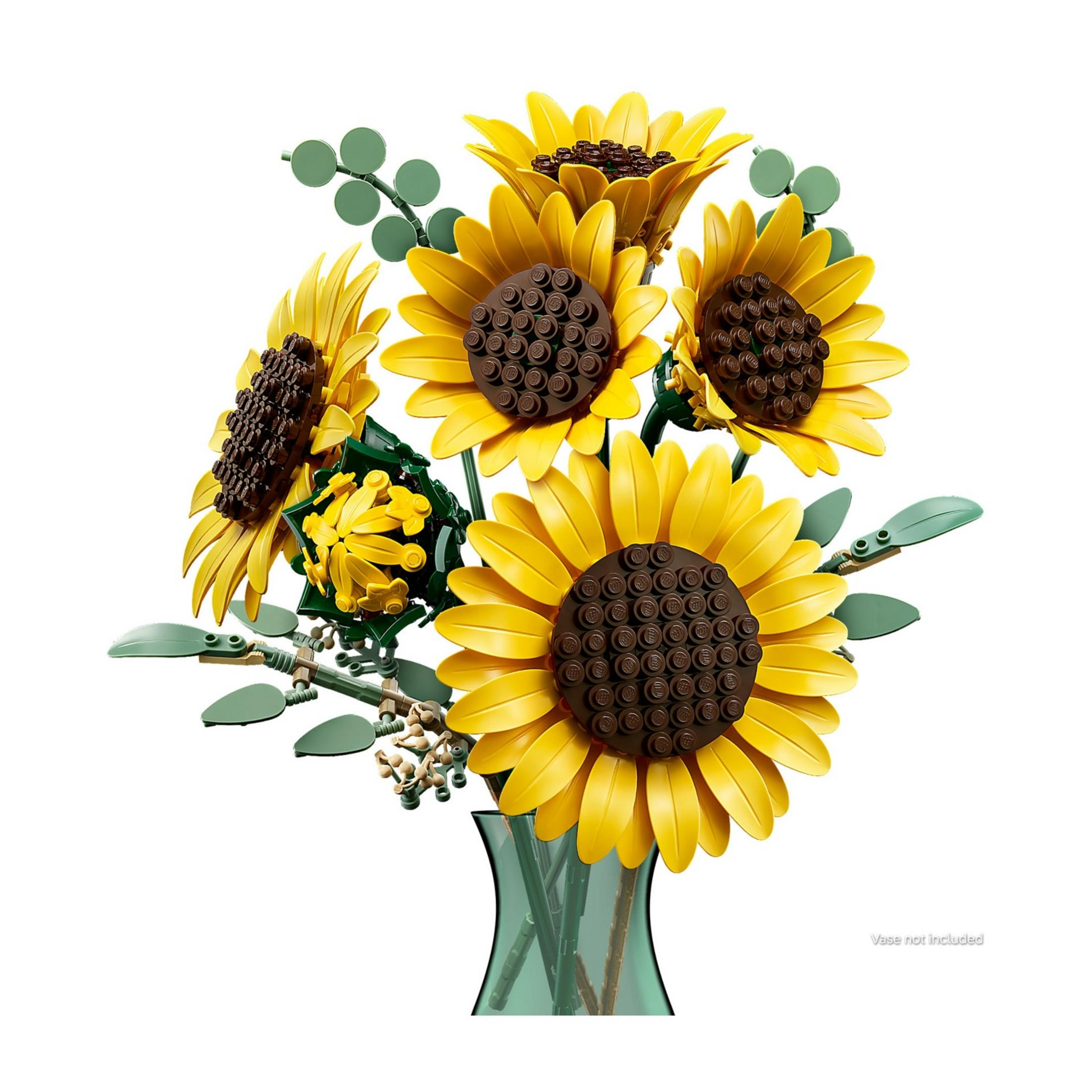 Un bouquet LEGO di girasoli gialli e foglie verdi in un vaso verde.