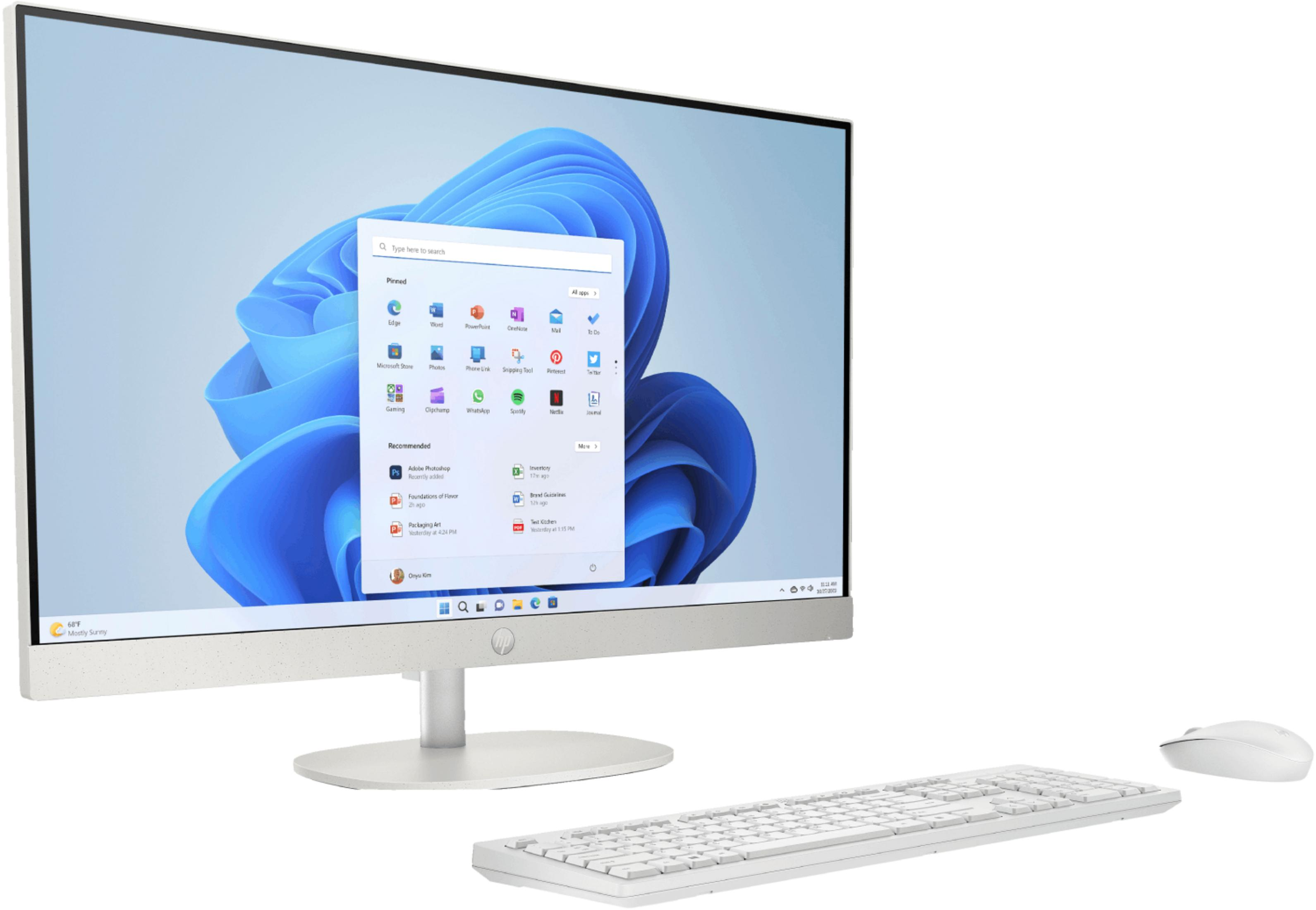 Un ordenador blanco todo en uno con Windows 11, teclado y ratón.