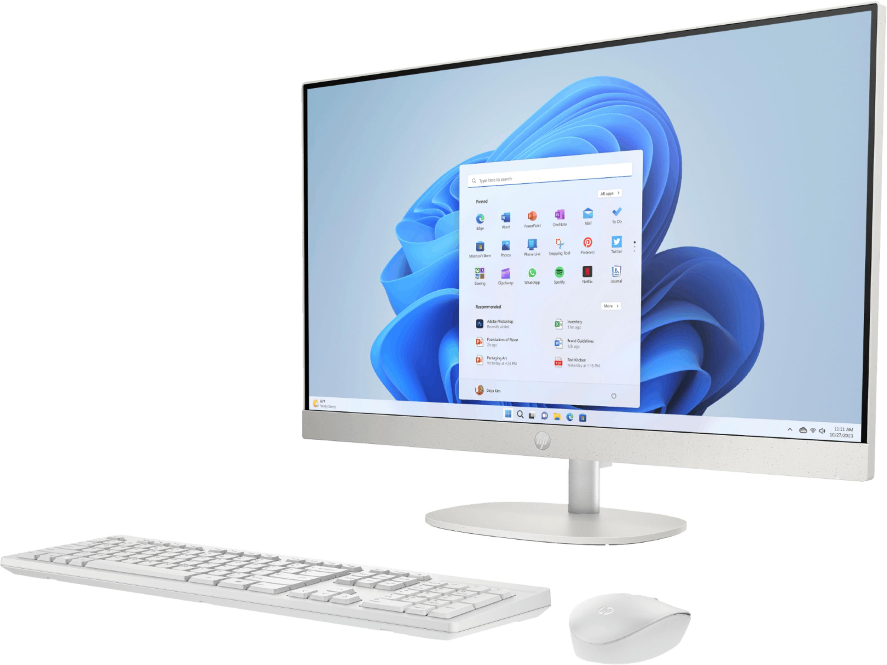Un ordenador todo en uno blanco con teclado y ratón sobre fondo claro.