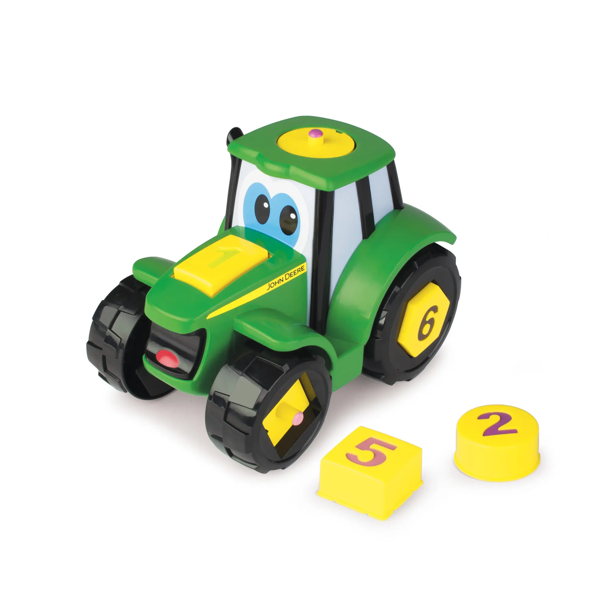 Ein grüner Spielzeugtraktor mit gelben und schwarzen Akzenten und lustigen Augen.