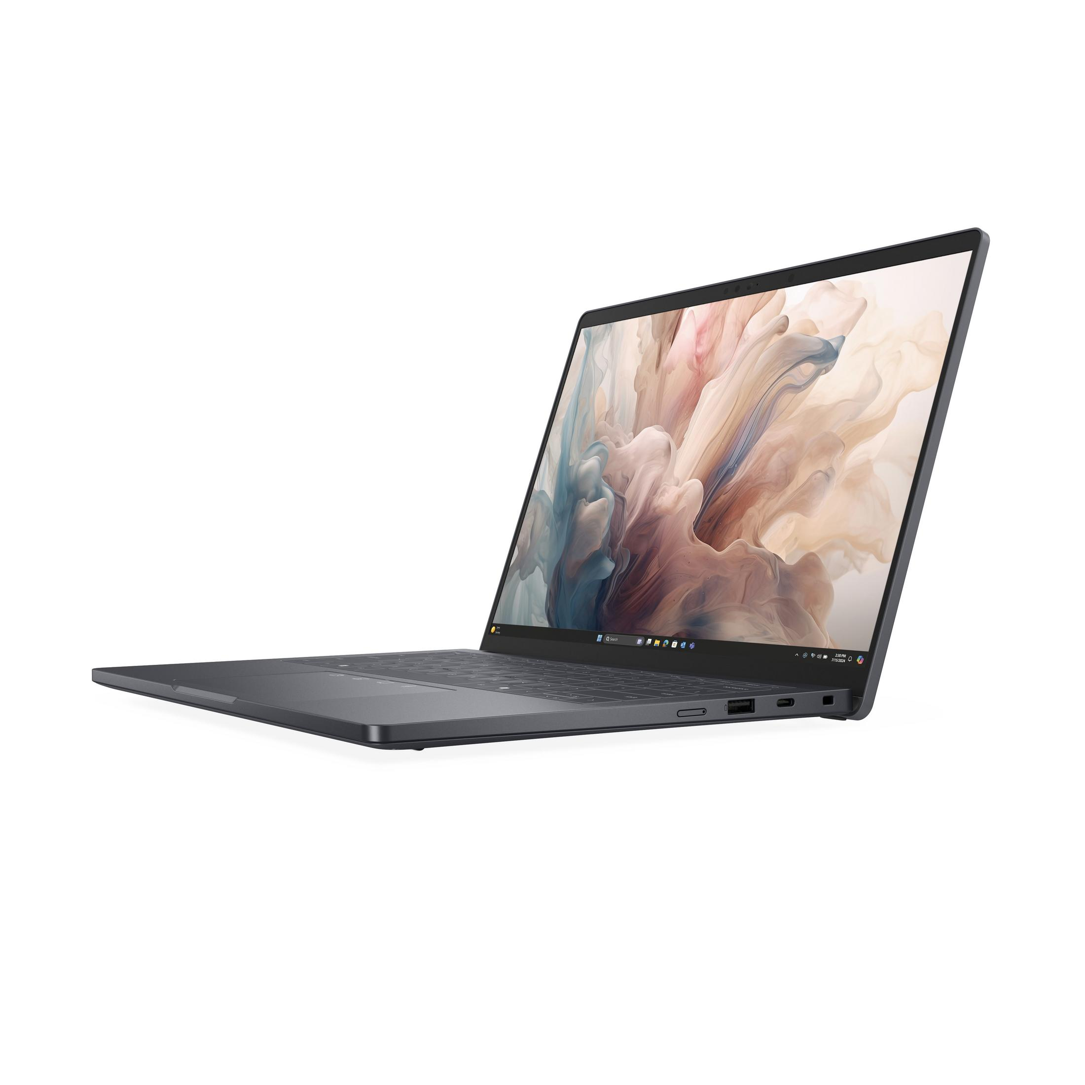 Zamknięty, ciemny laptop z abstrakcyjnym tłem na ekranie.