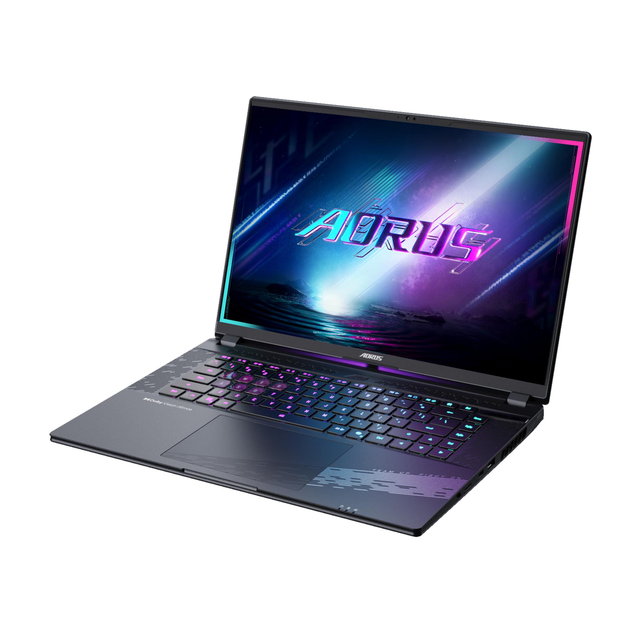 Un portátil abierto con teclado iluminado y el logo "AORUS" en la pantalla.