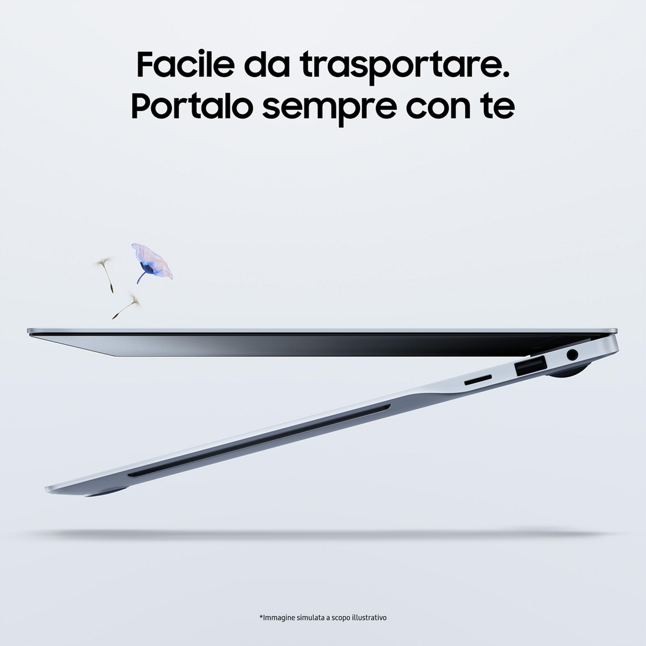 Un elegante laptop argentato si apre, con petali che fluttuano sopra.