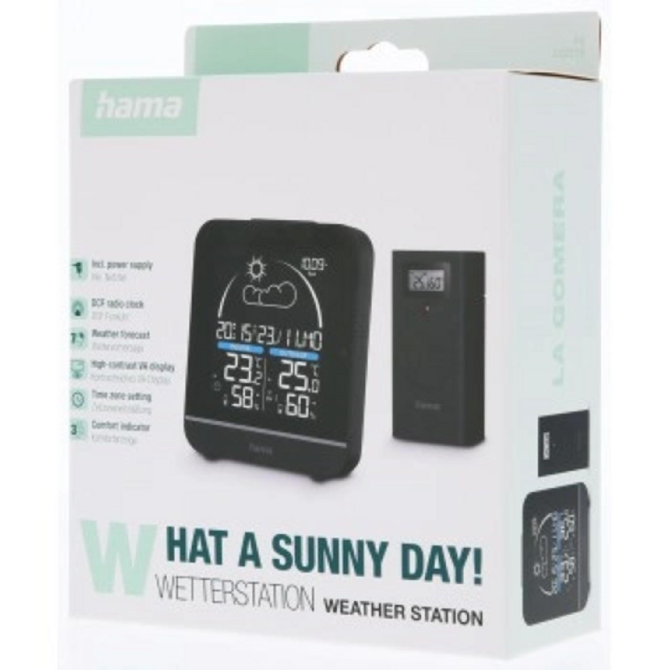 Verpackung einer Wetterstation mit einem Hauptgerät und einem Außensensor.