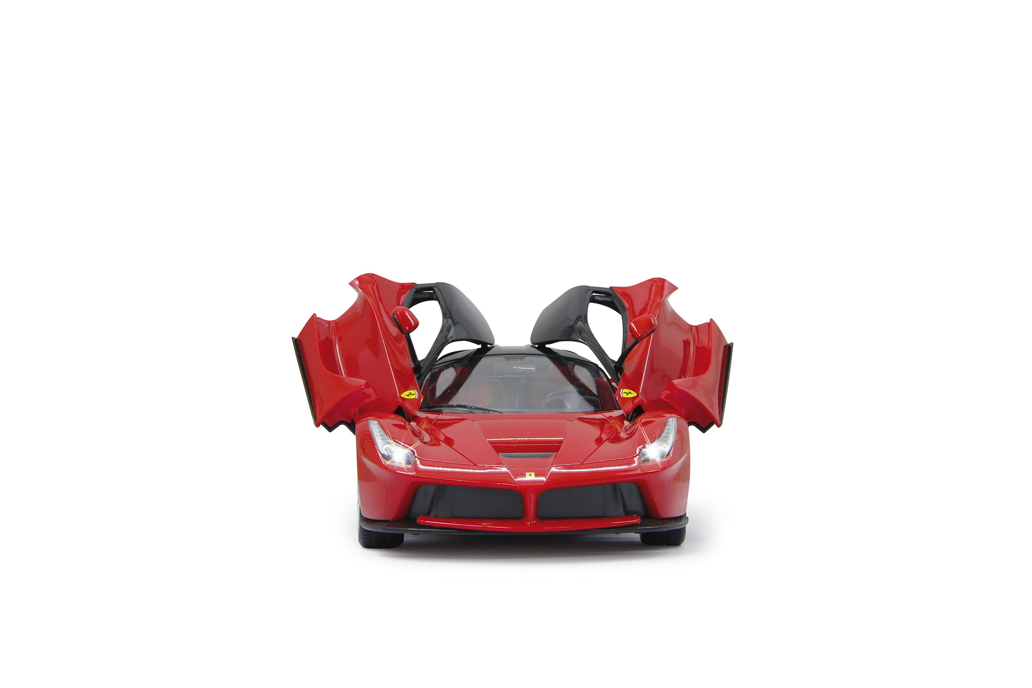 A red toy Ferrari car with its dihedral doors open.