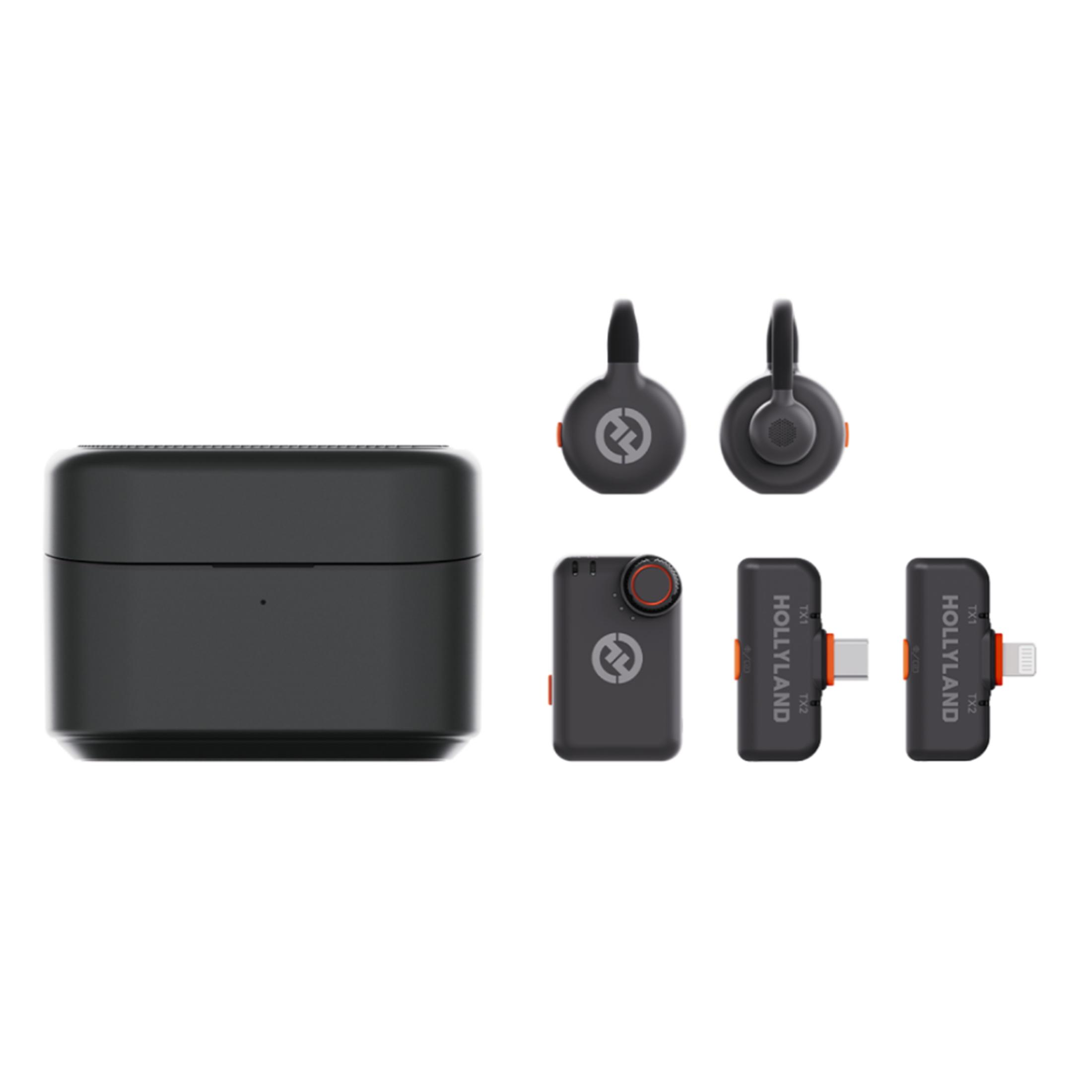 Una custodia di ricarica nera e tre microfoni lavalier wireless con accenti arancioni.