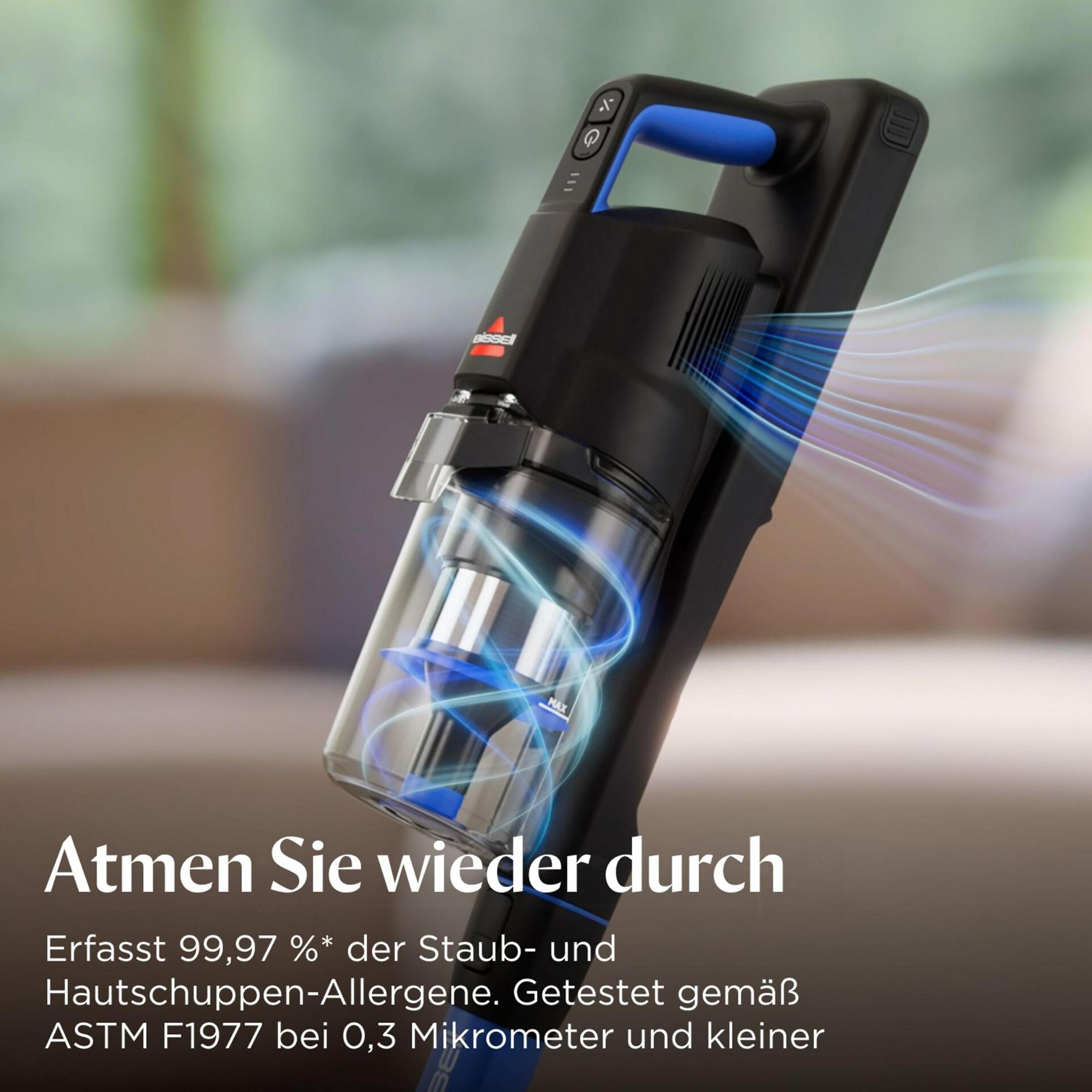 Ein schwarzer Handstaubsauger mit blauem Griff und durchsichtigem Staubbehälter.