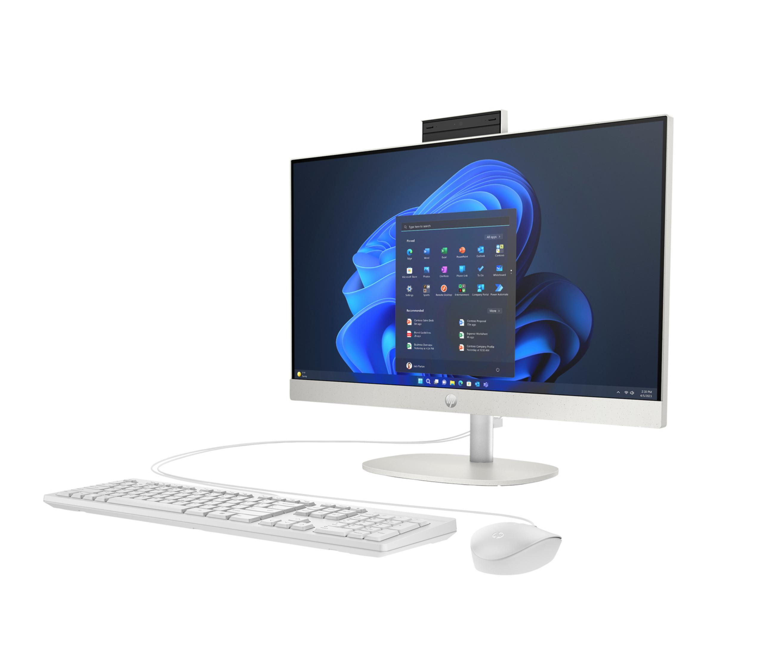 Un computer all-in-one bianco con tastiera e mouse su sfondo bianco.