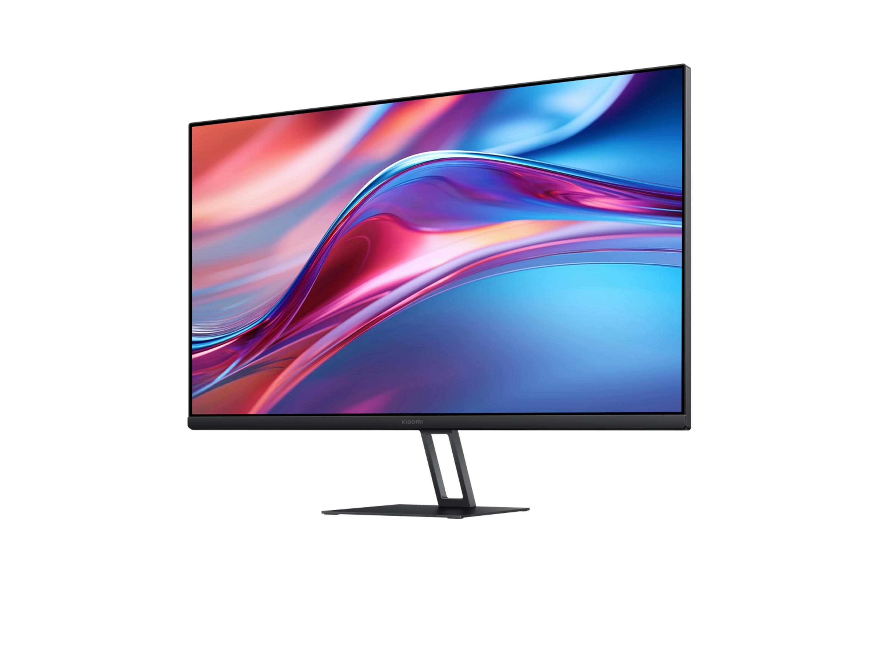 Un monitor moderno que muestra un fondo de pantalla abstracto y colorido a pantalla completa.