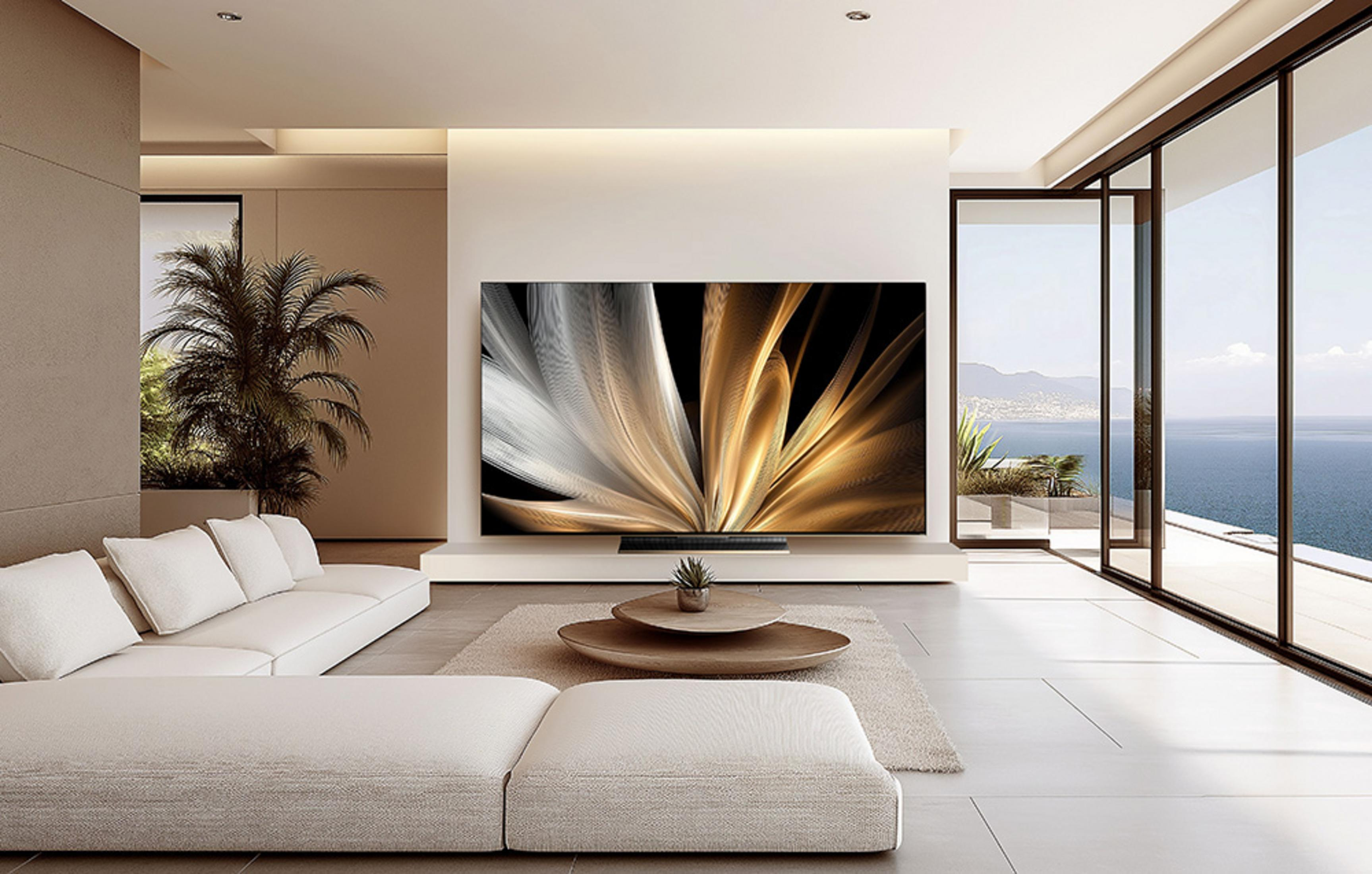 Salon moderne avec canapé, TV affichant de l'art abstrait et vue sur mer.