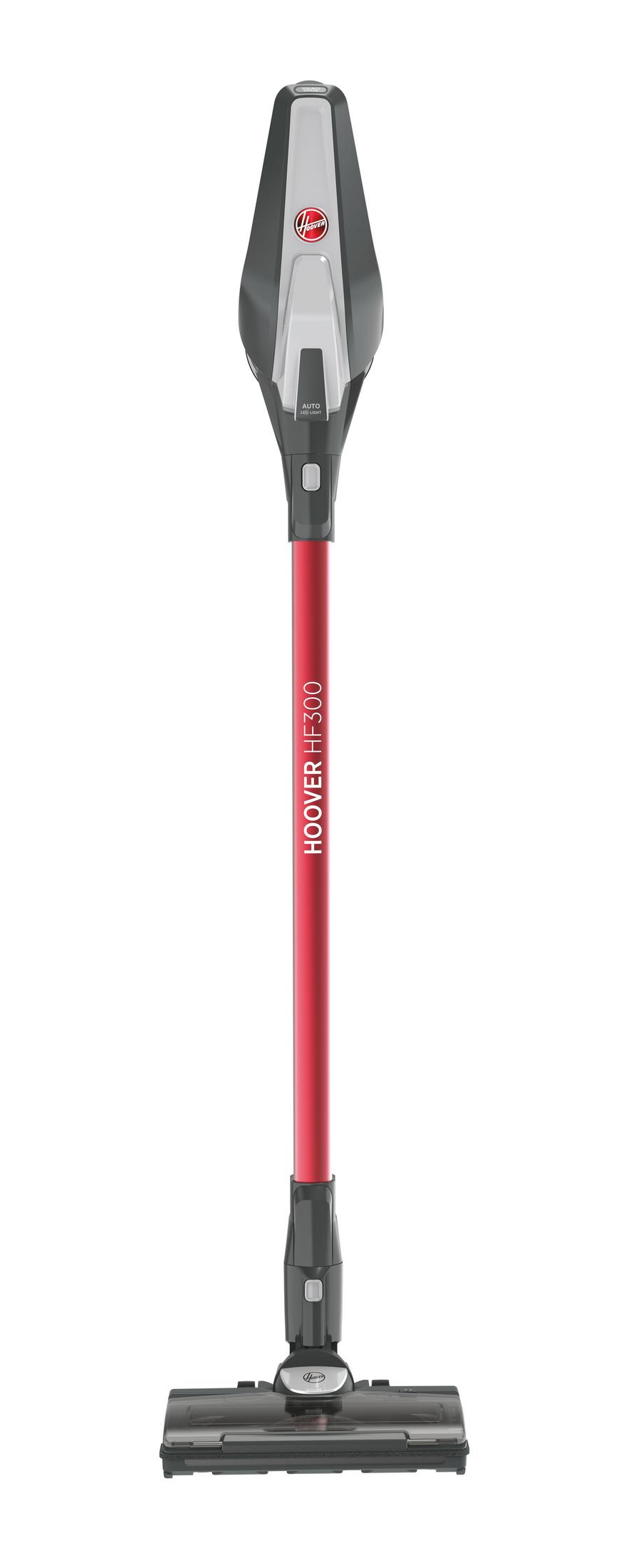 Un aspirapolvere senza fili Hoover HF300 grigio e rosso su sfondo bianco.