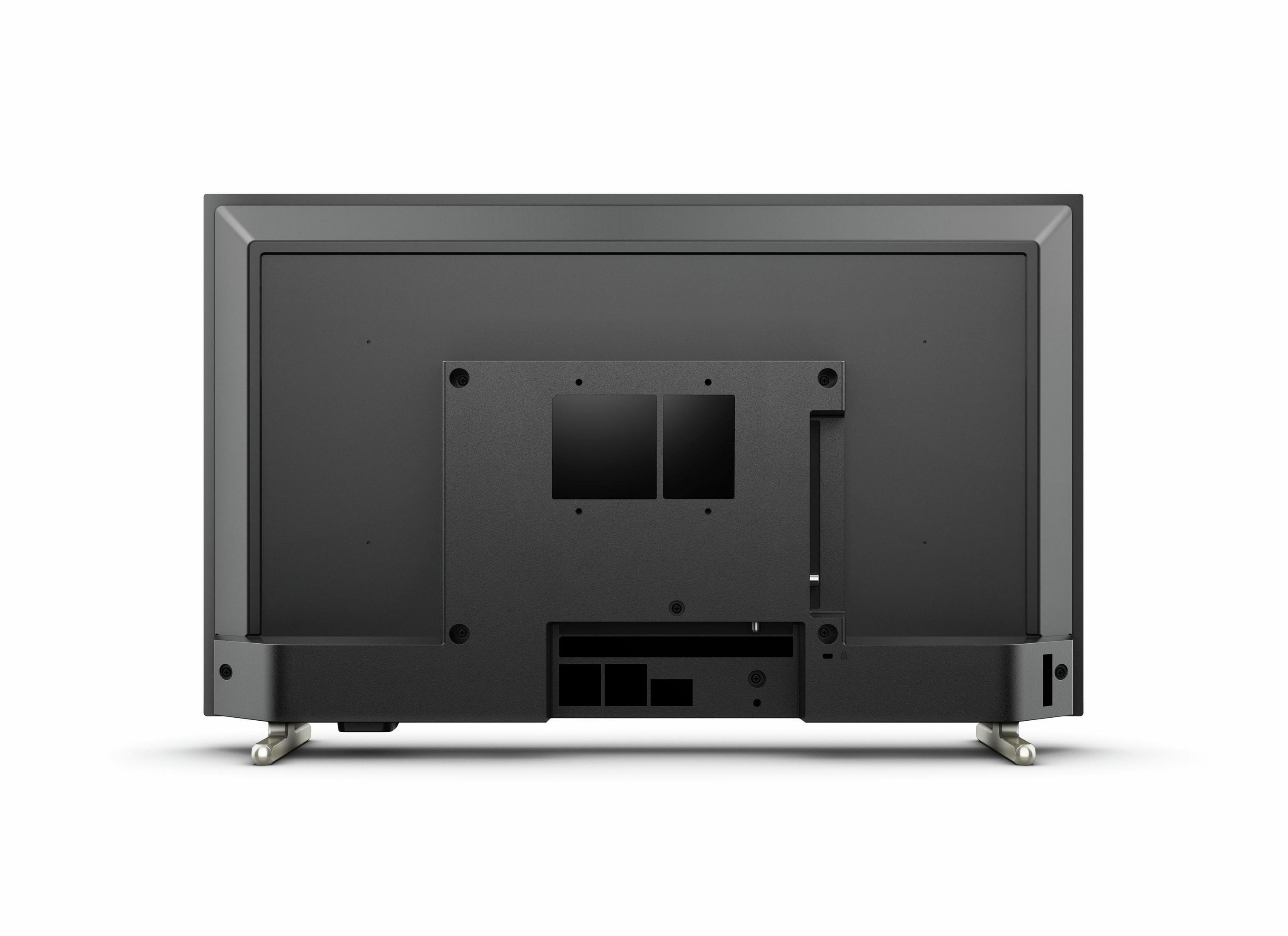 Retro di una TV nera con porte e piedini argentati.