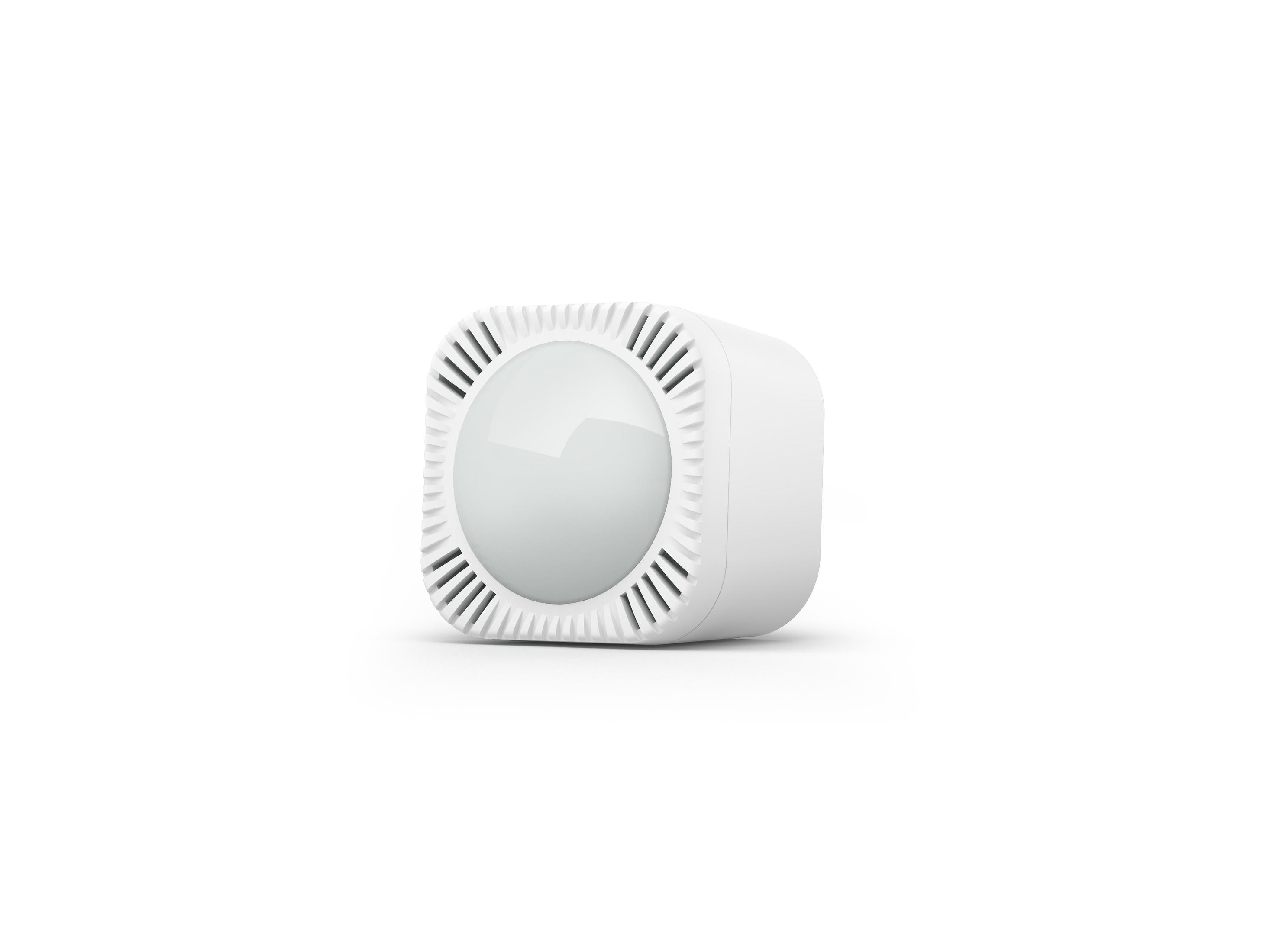 Un dispositivo bianco, a forma di cubo, con un centro rotondo e a cupola e un bordo scanalato.