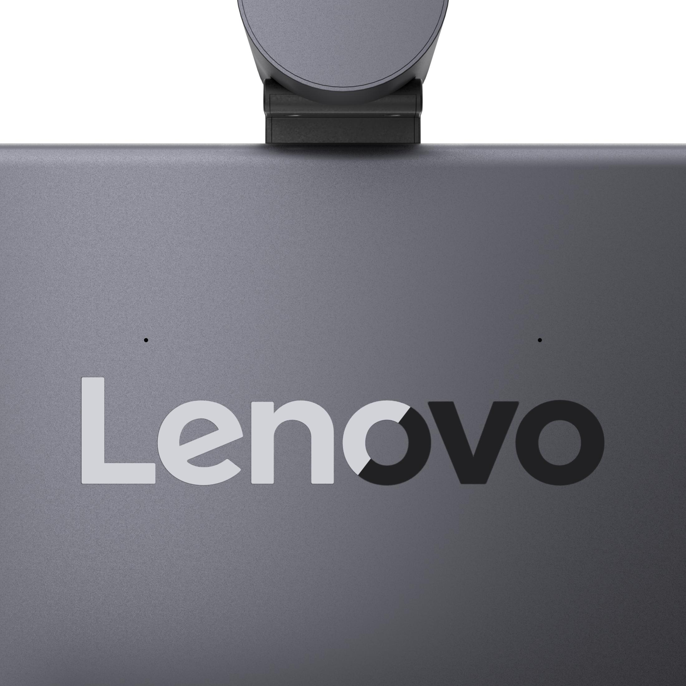 Grauer Lenovo-Schriftzug auf einem dunklen Bildschirm mit einer Webcam oben.