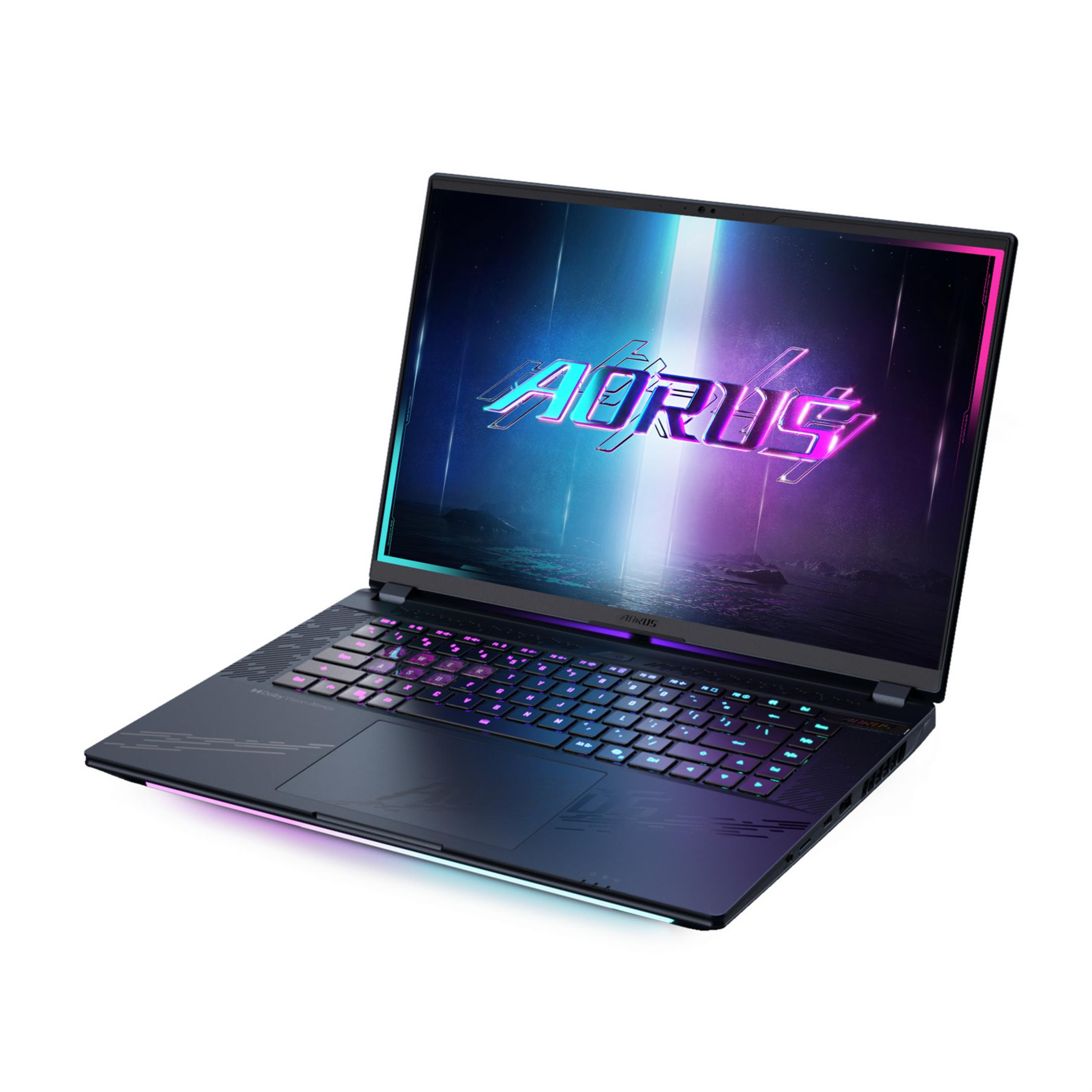 Un portátil negro con teclado iluminado y logo AORUS iluminado en pantalla.