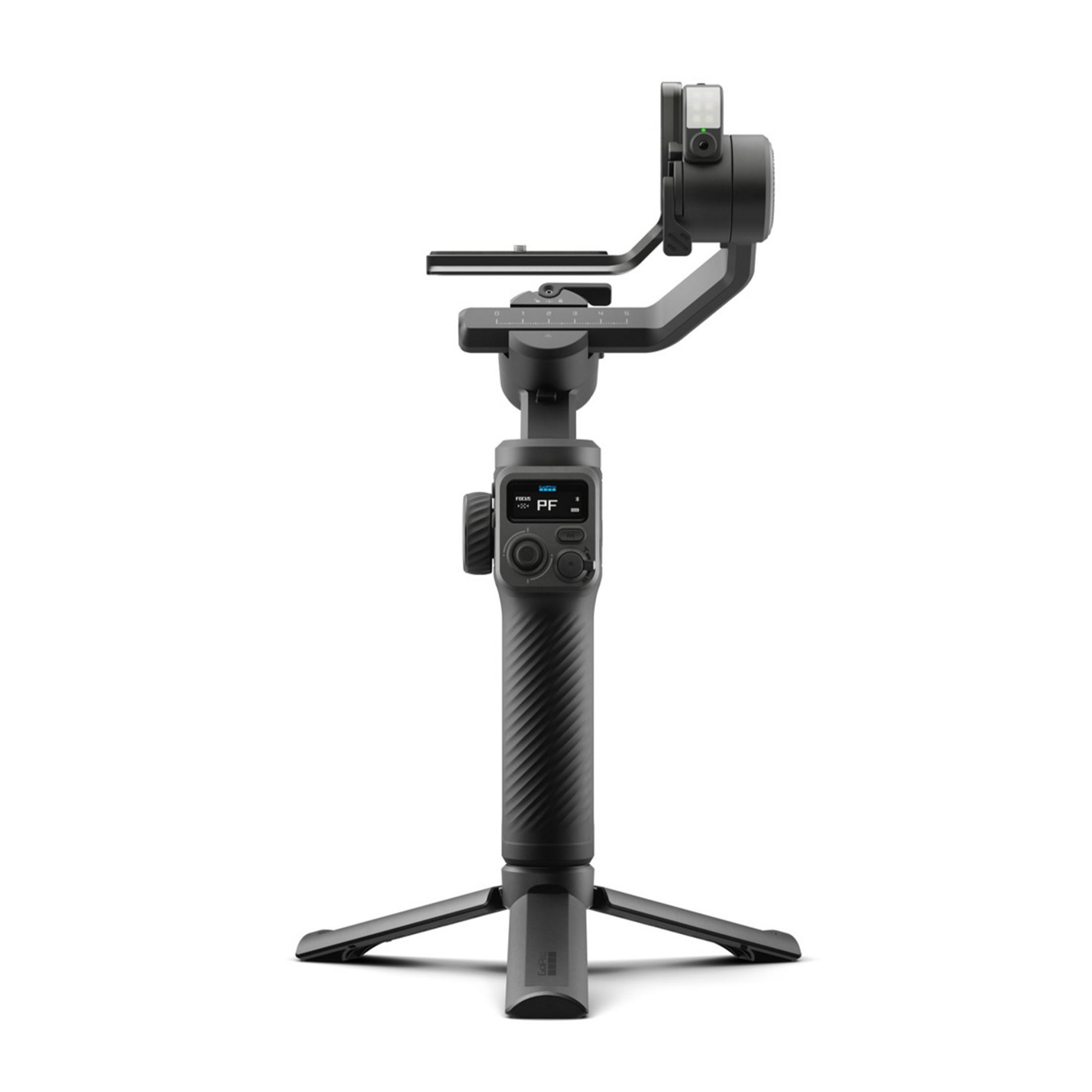 Ein schwarzer Gimbal-Stabilisator mit Kamerahalterung und Bedienelementen steht auf einem Stativ.