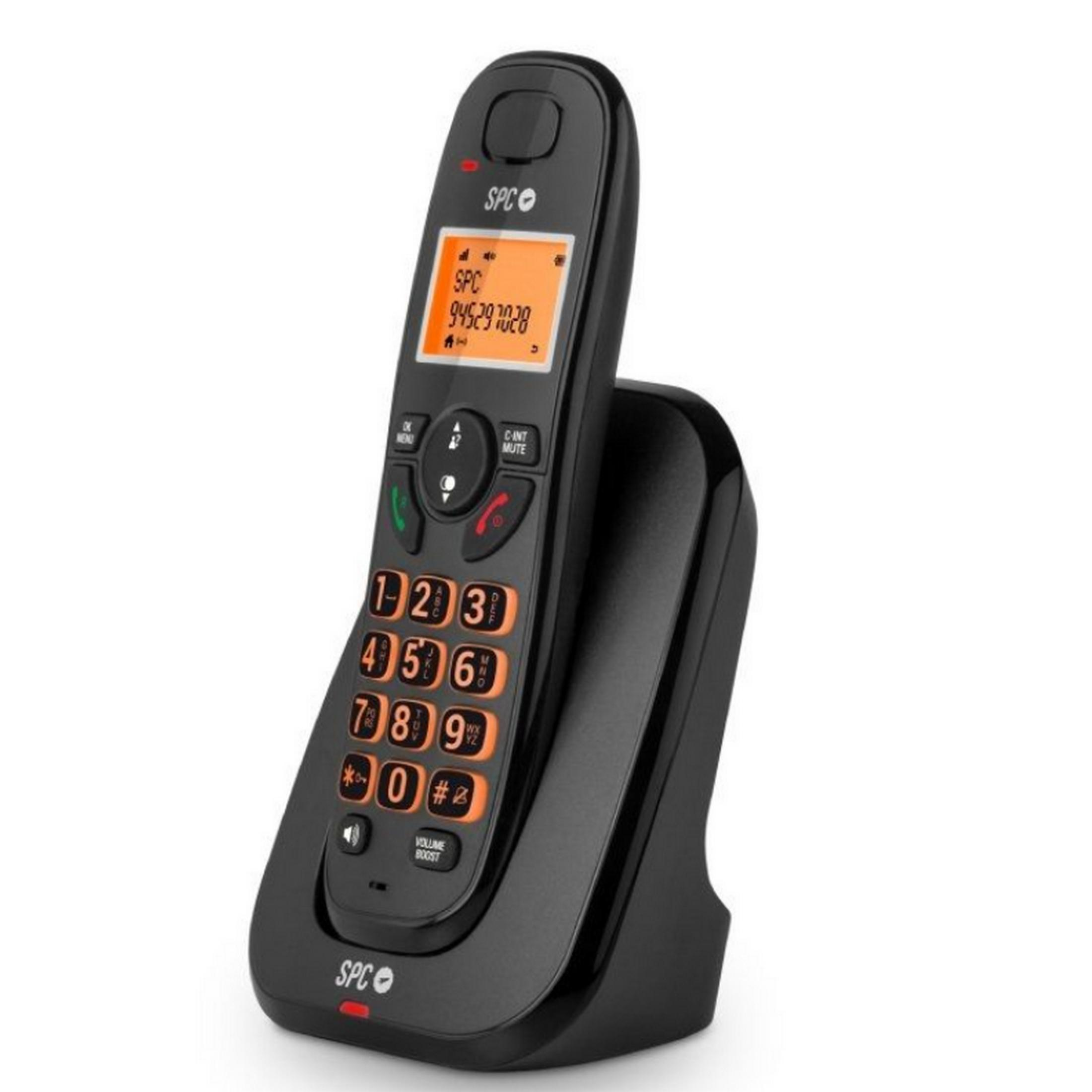 Un telefono cordless nero con tastiera e display arancioni poggia sulla sua base di ricarica.
