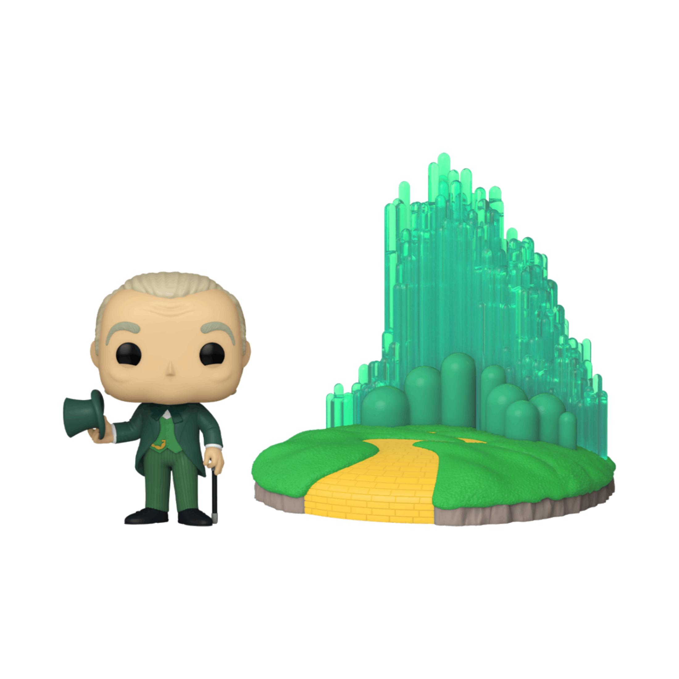 Un personaje Funko Pop con traje verde, sombrero y bastón, junto al set de la Ciudad Esmeralda.