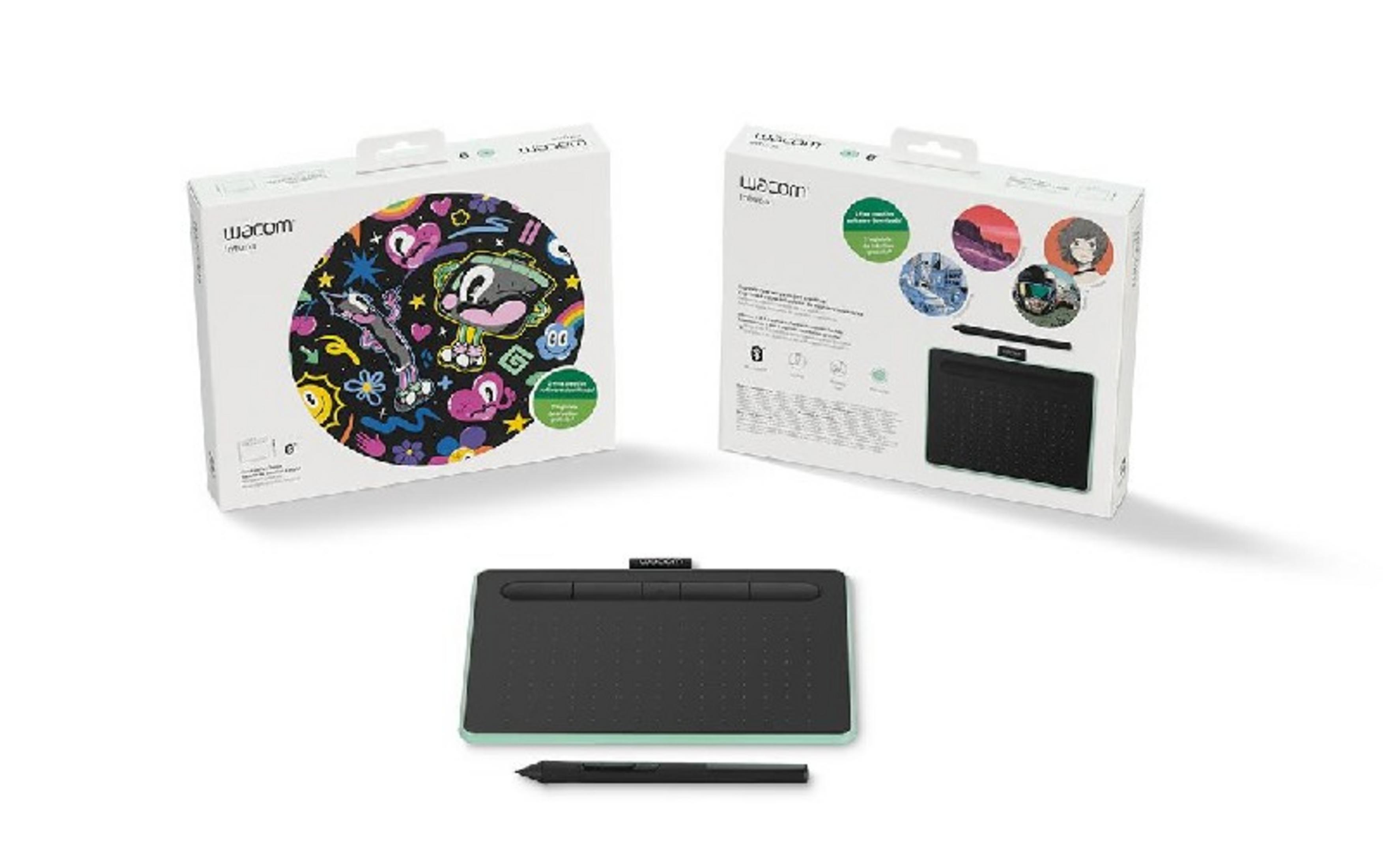 Tavoletta grafica nera con stilo e due scatole Wacom, una colorata, una con immagini.