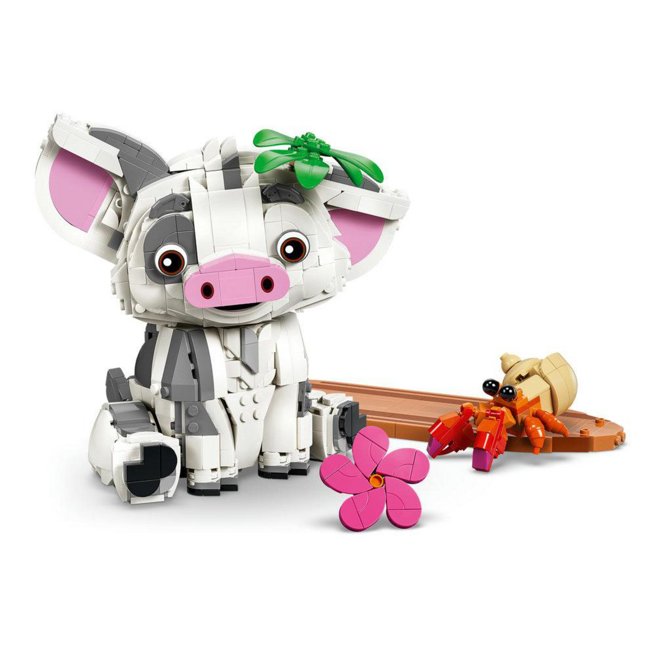 Model LEGO Pui, świni z filmu Vaiana, siedzi obok kraba pustelnika i kwiatka.
