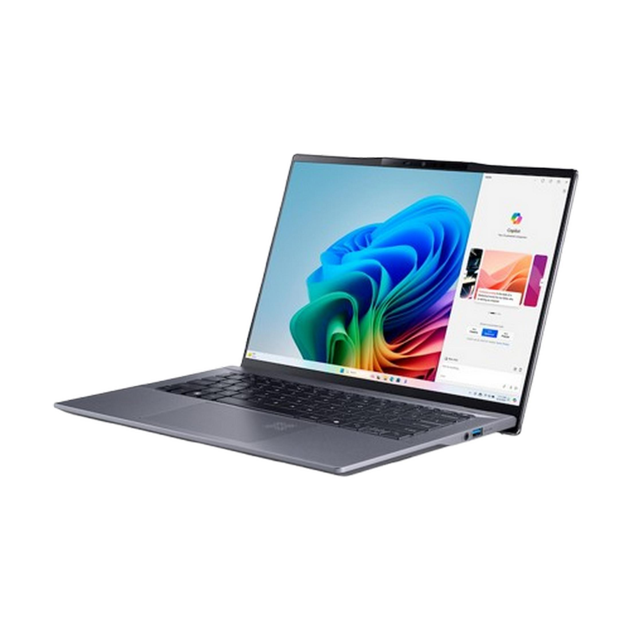 Un portátil gris con un fondo de pantalla colorido en la pantalla.