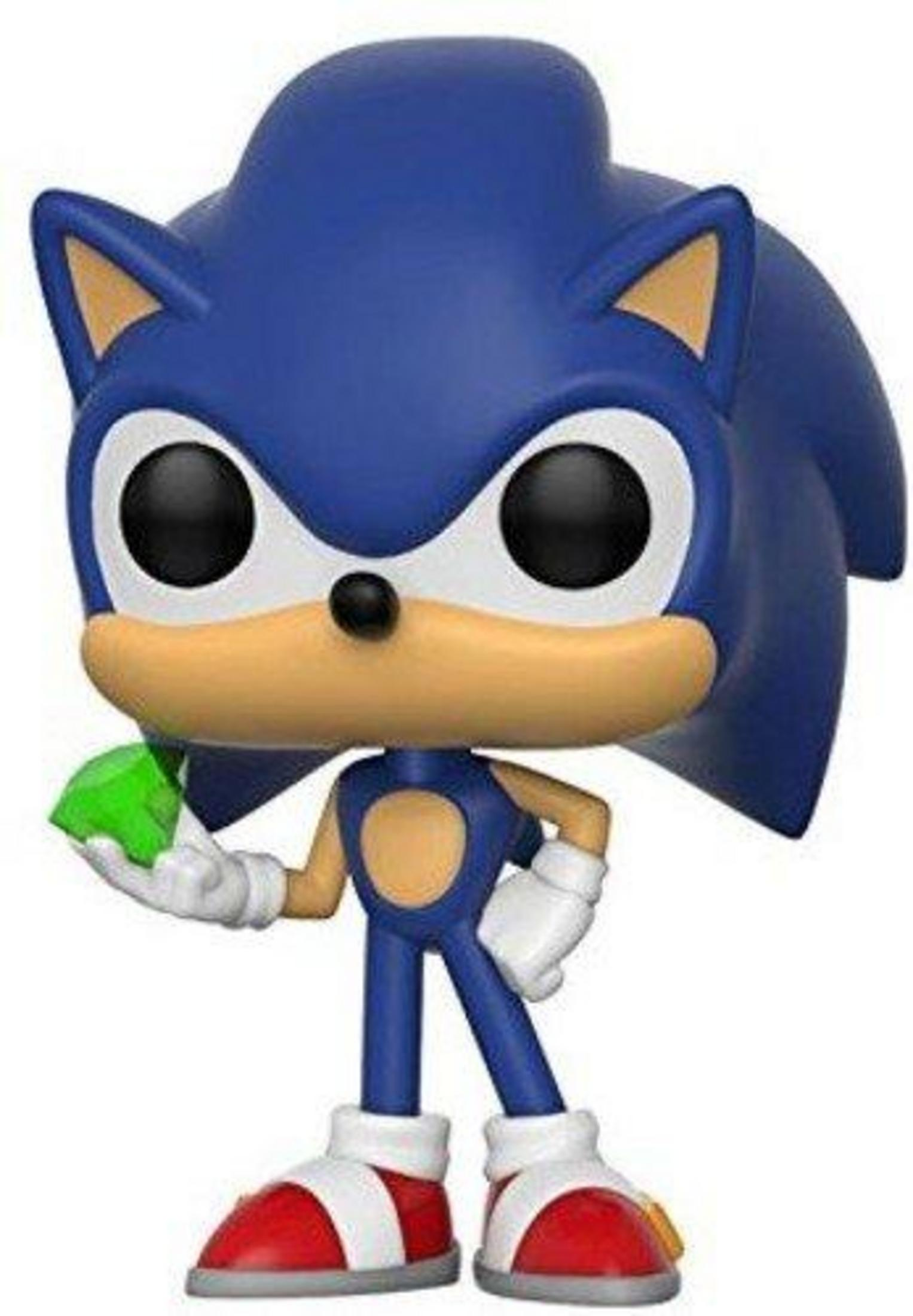 Sonic the Hedgehog figure holding a green Chaos Emerald, wearing red shoes.