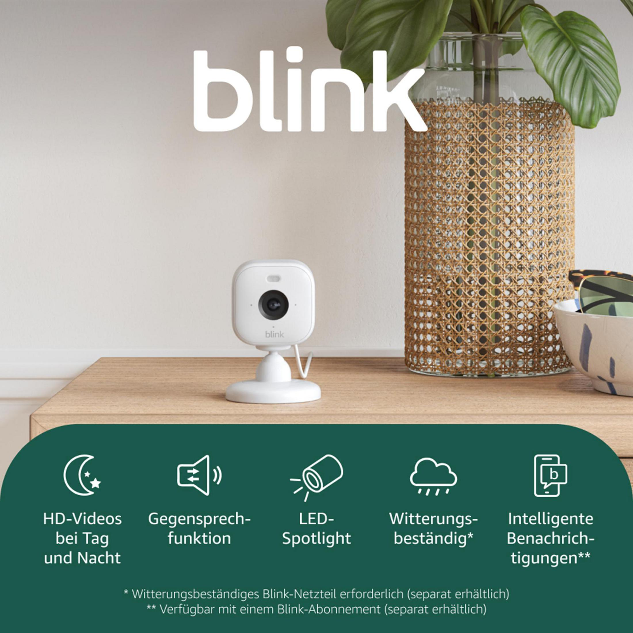Blink Kamera auf einem Nachttisch mit Funktionen wie HD-Videos, Gegensprechfunktion.