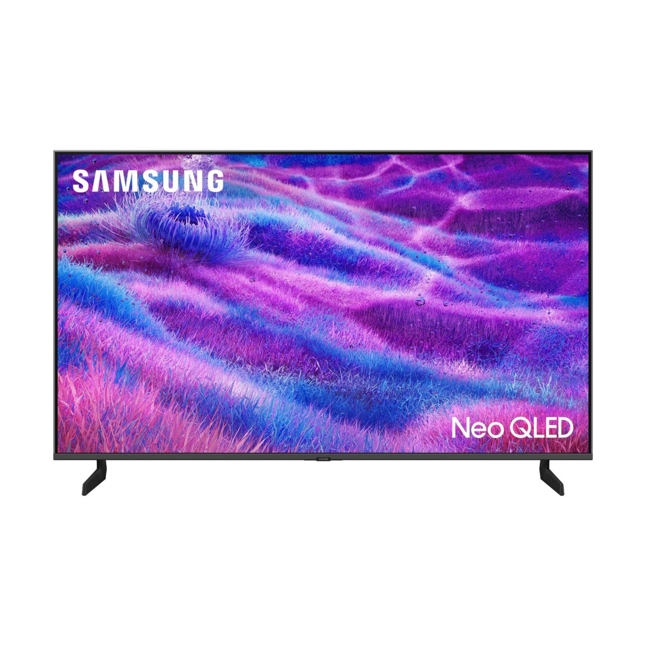 Une TV Samsung Neo QLED sur un pied affiche une image colorée.
