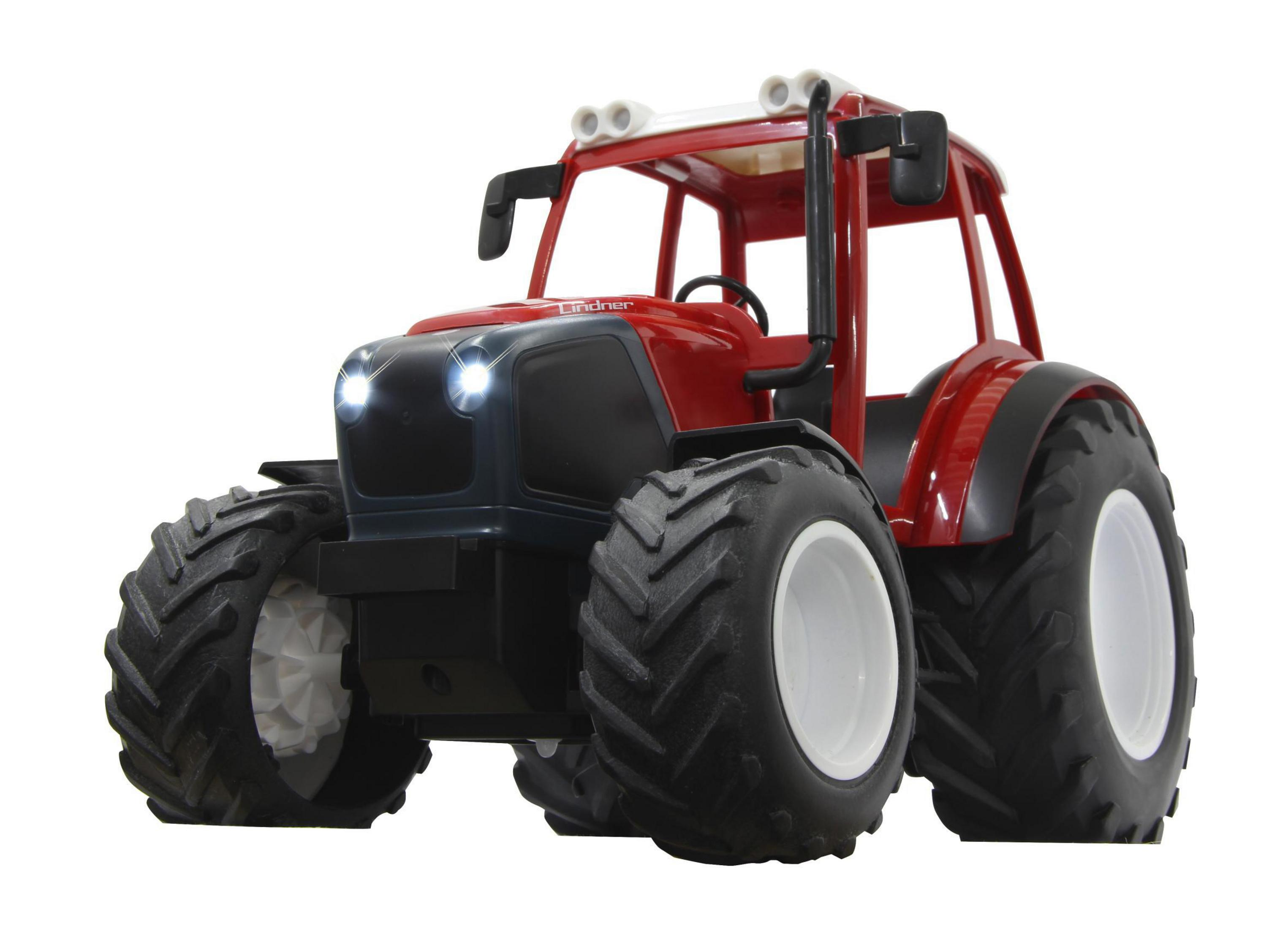 Ein roter Spielzeugtraktor mit großen Reifen und leuchtenden Scheinwerfern.