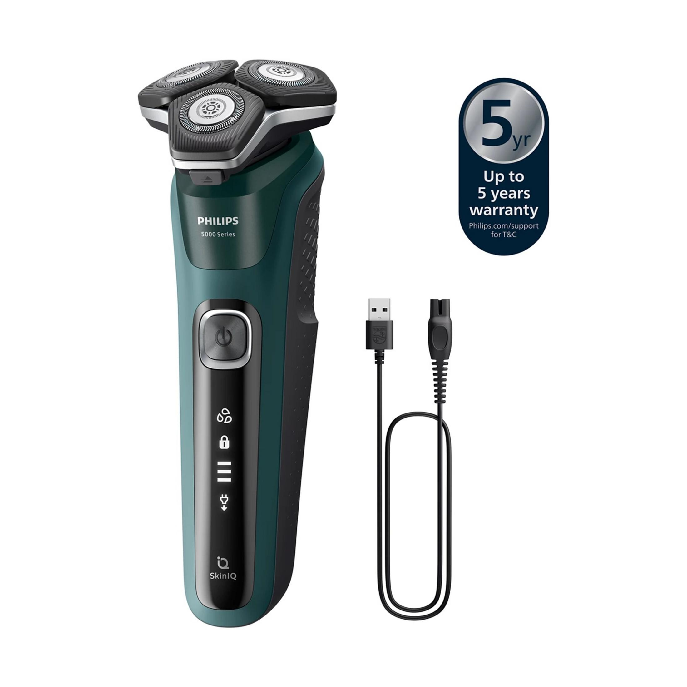 Un rasoir Philips vert avec câble de chargement et autocollant de 5 ans de garantie.