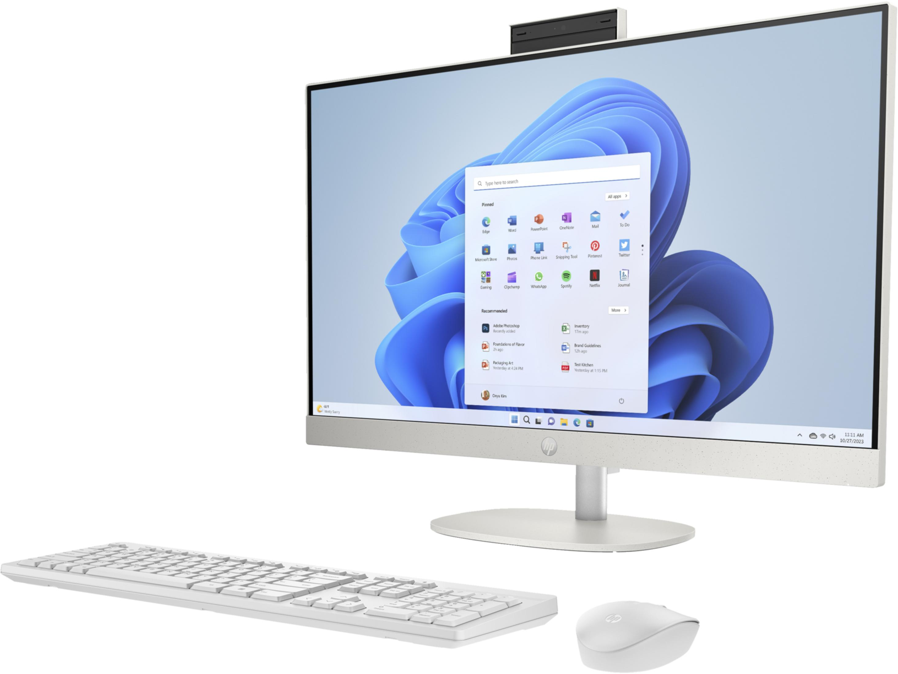 Un ordenador todo en uno blanco con teclado y ratón, mostrando Windows 11.