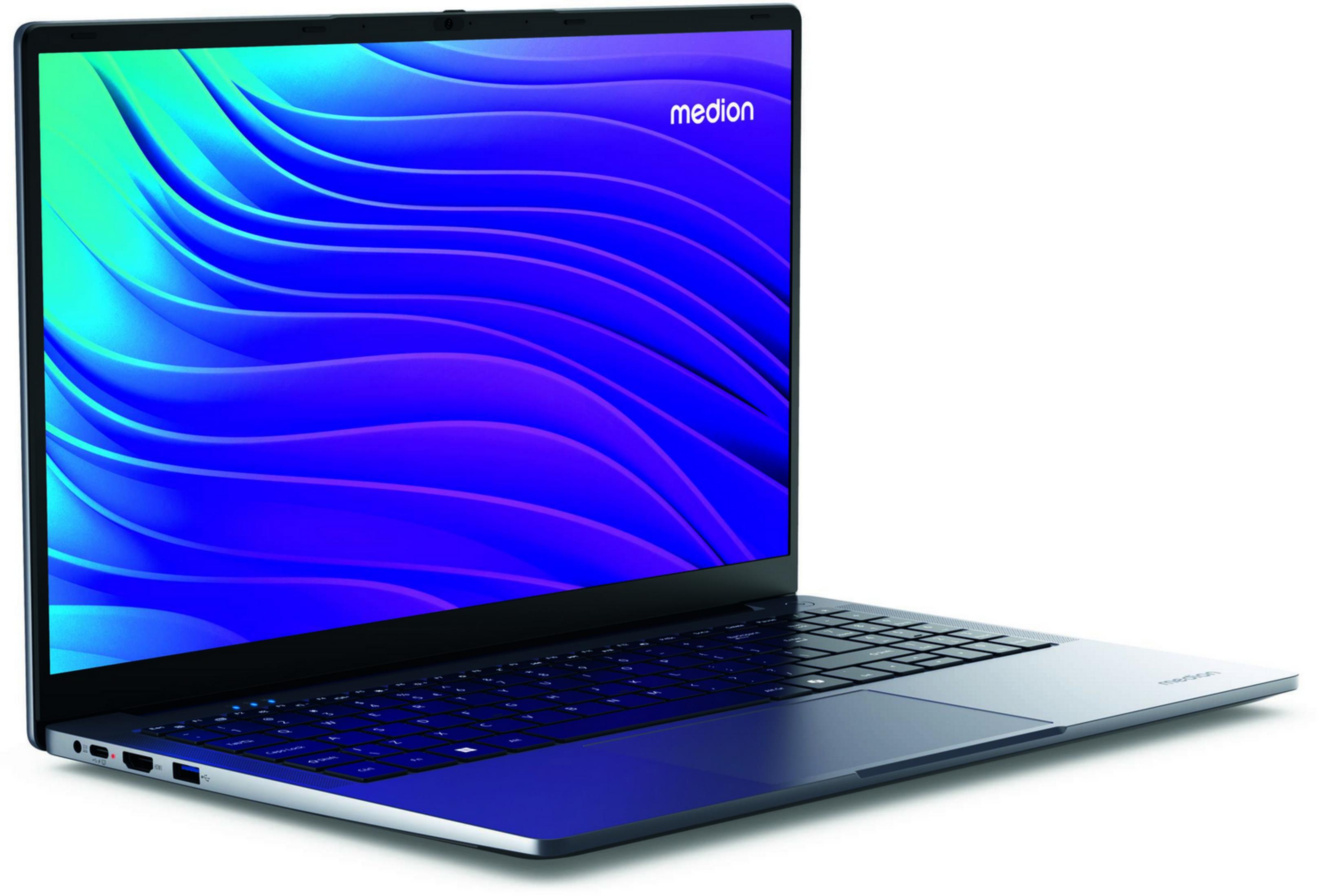 Un portátil Medion abierto con fondo azul ondulado y teclado.