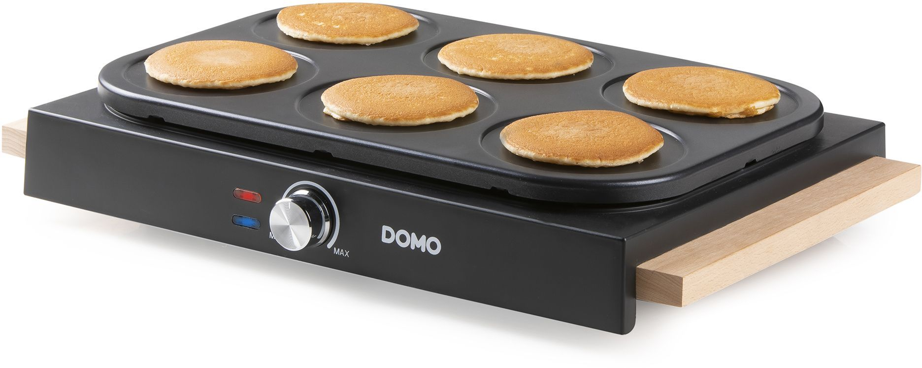Ein Domo-Pfannkuchengrill mit sechs goldbraunen Pfannkuchen.