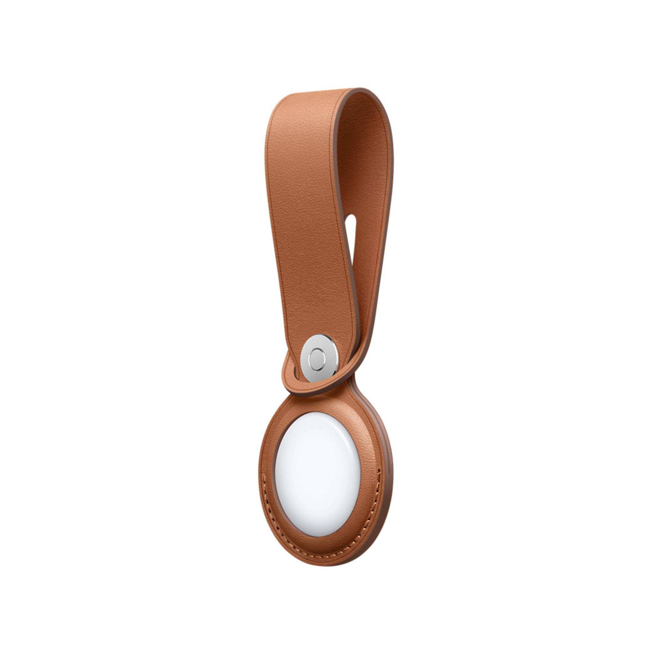 Un anello in pelle marrone fissato a un oggetto bianco rotondo tramite un perno argentato.