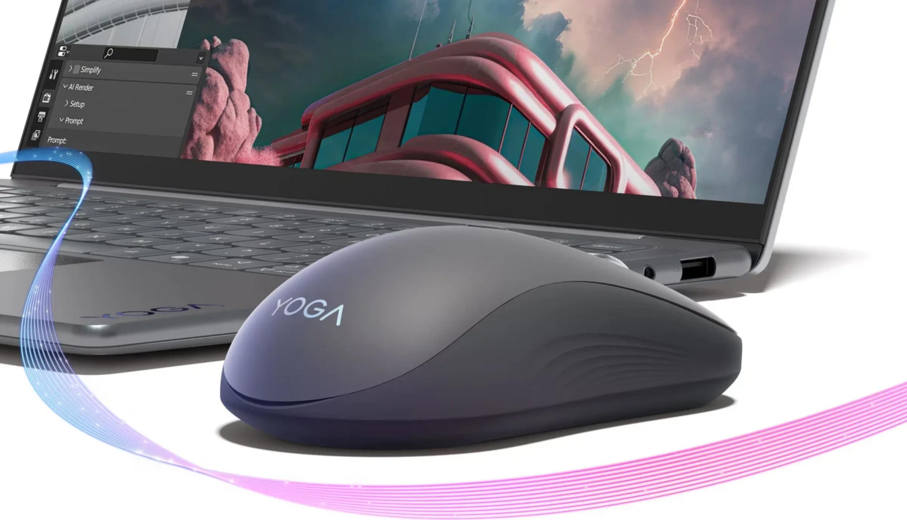 Un mouse grigio Lenovo Yoga davanti a un laptop con paesaggio surreale sullo schermo.
