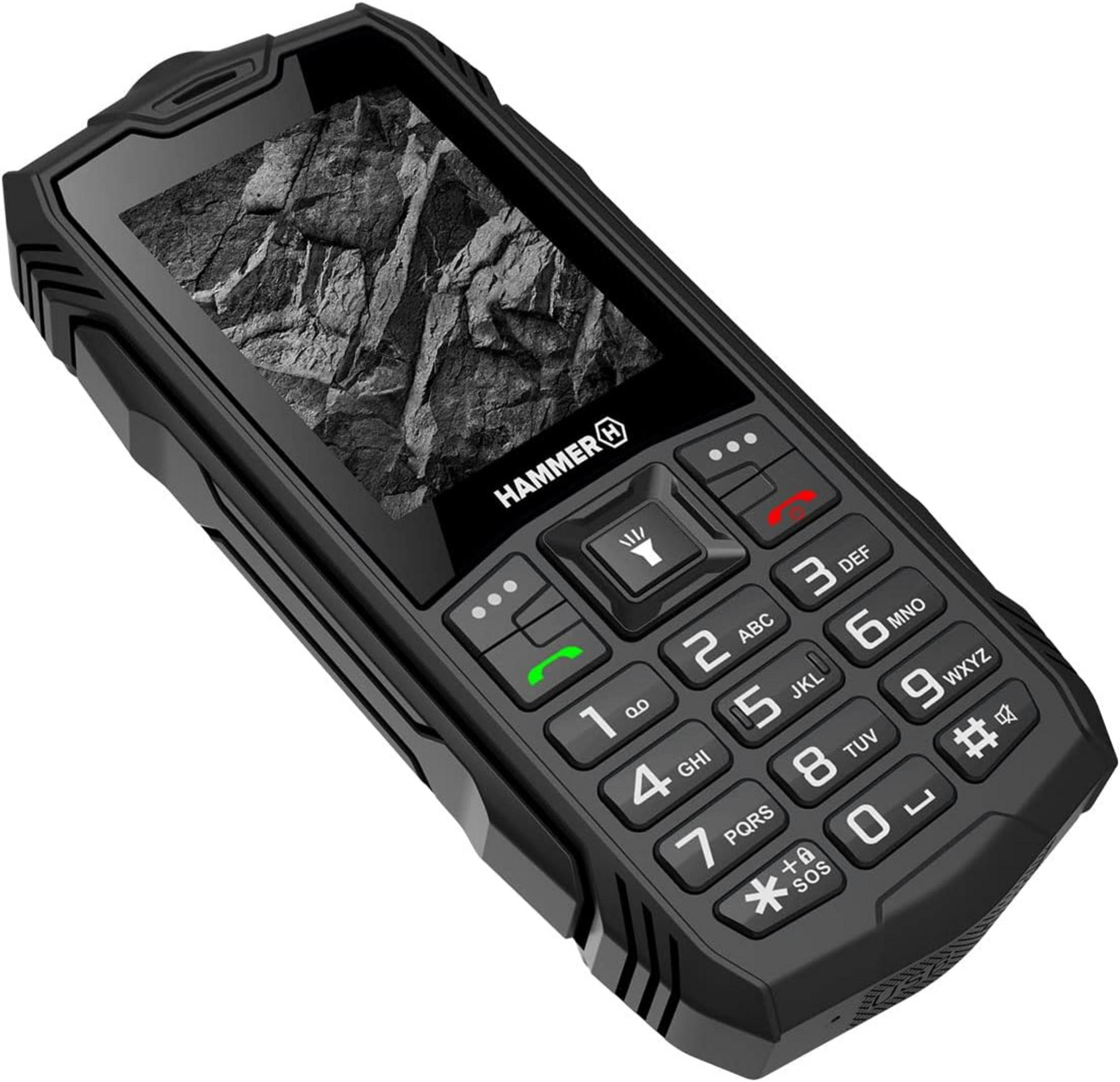 Un telefono cellulare Hammer nero con pulsanti e sfondo di pietra sullo schermo.