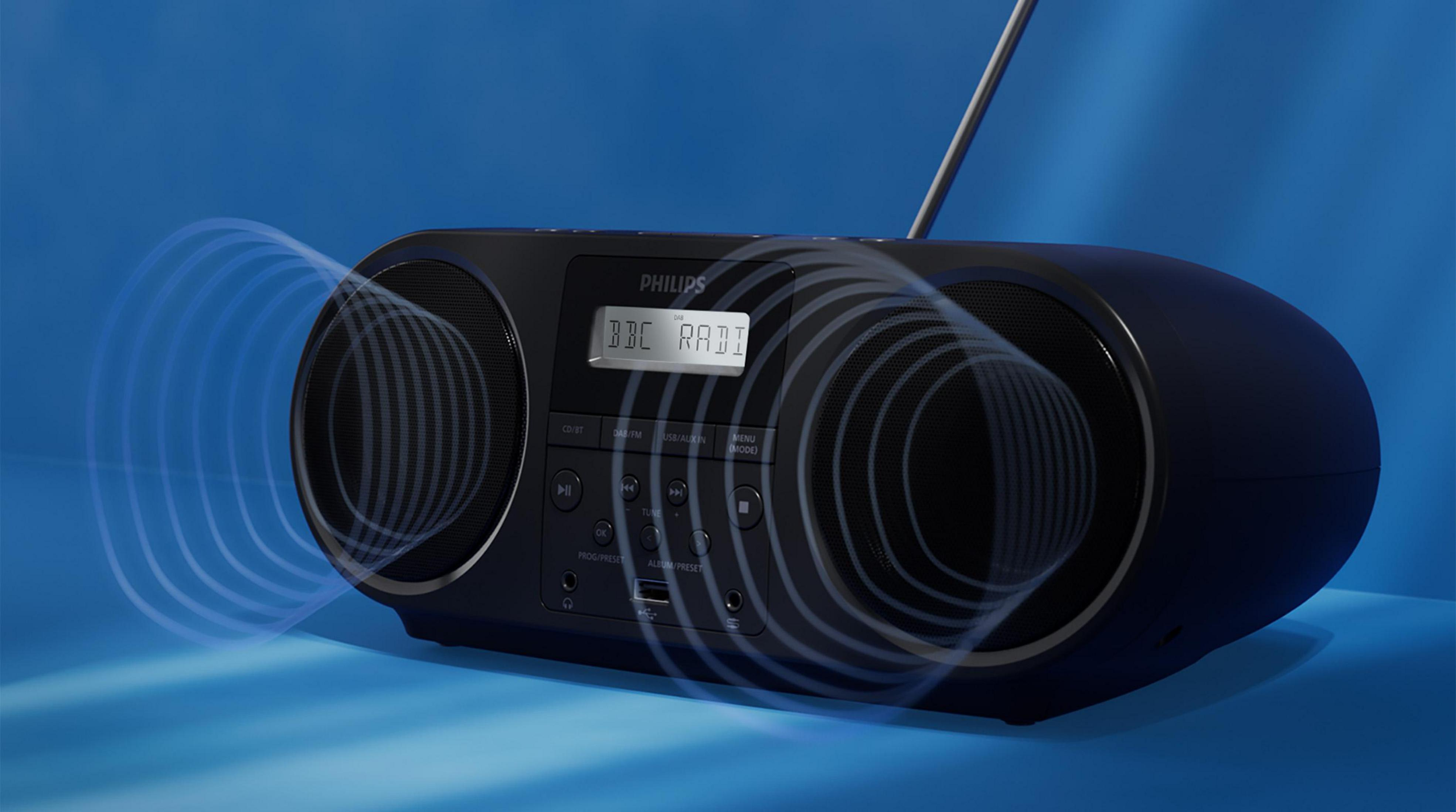 A black Philips boombox with DAB radio displaying 'BBC RADI'. Sound waves emanate.