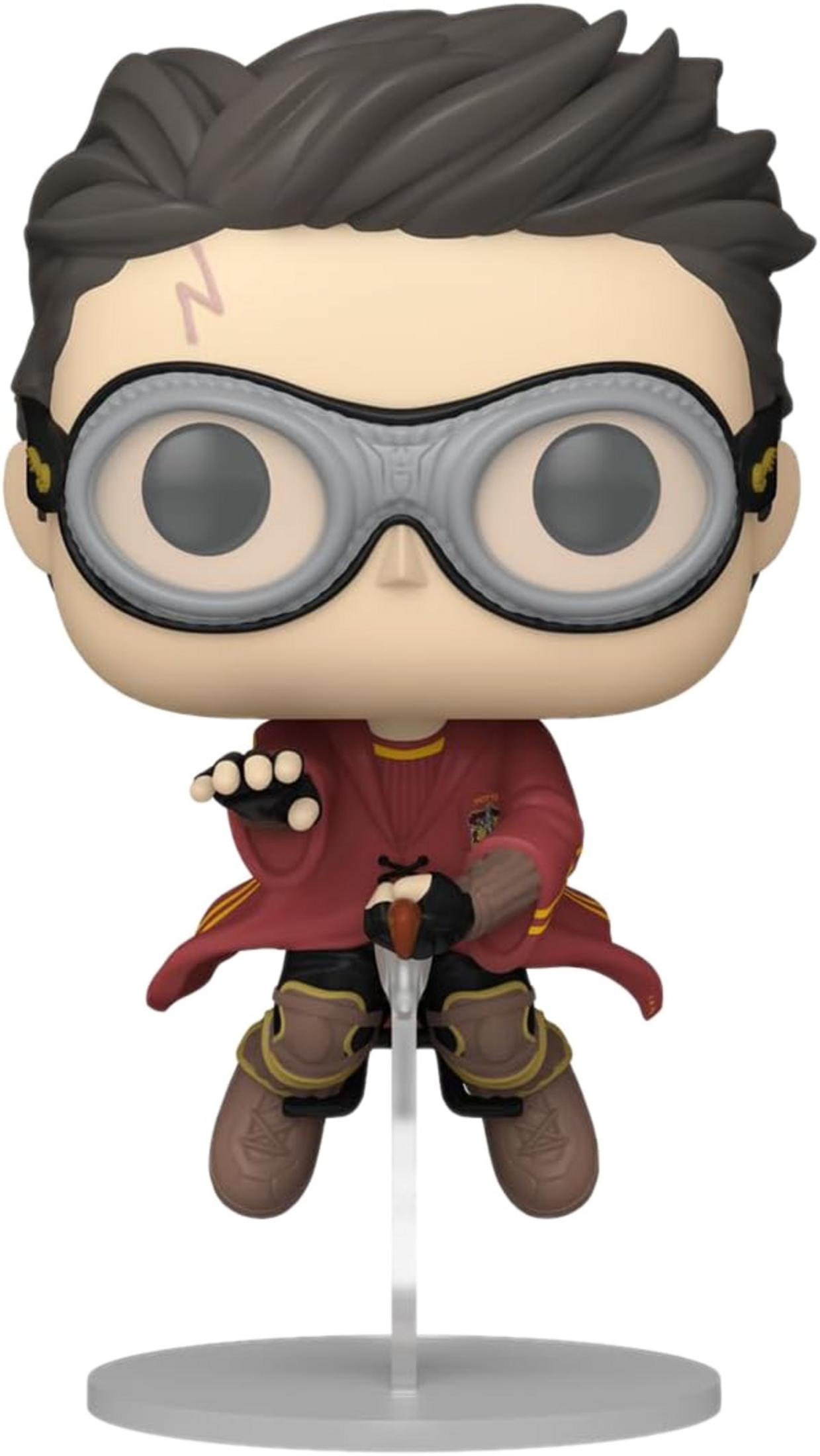 Funko Pop di Harry Potter con cicatrice e occhiali, vestito di rosso e giallo.