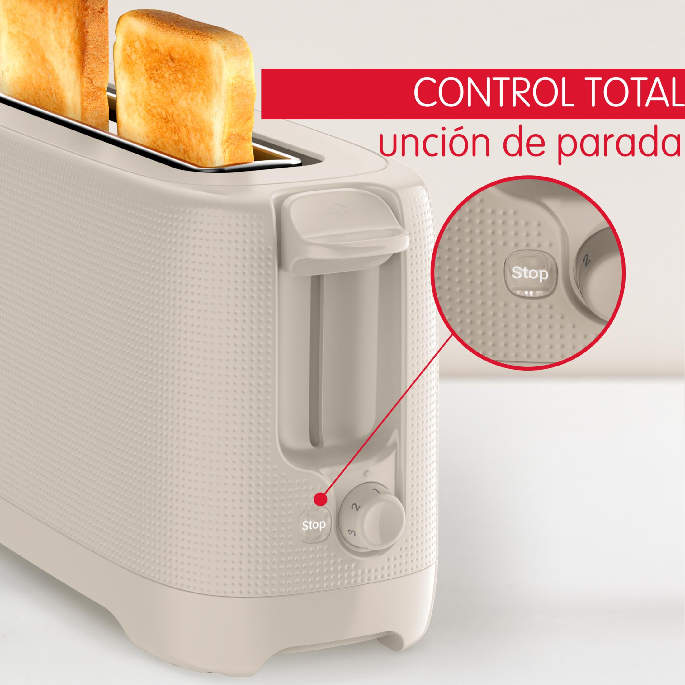 Una tostadora beige con dos rebanadas de pan tostado.