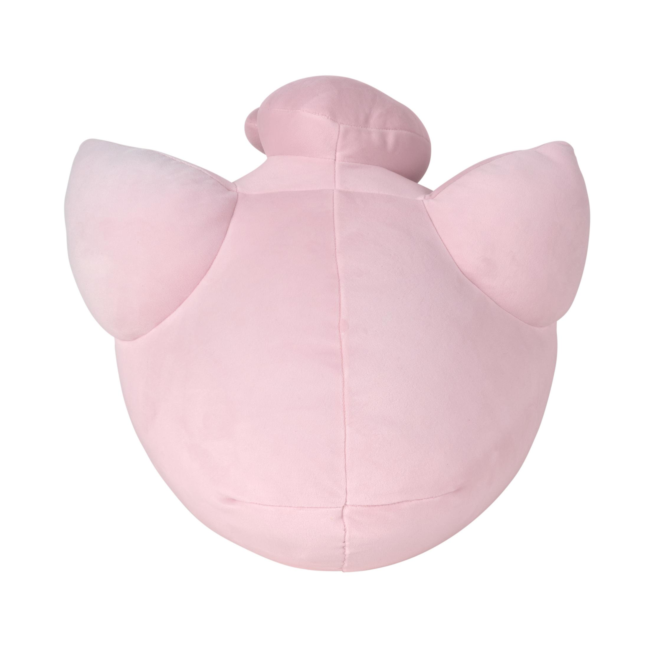 Un personnage en peluche rose avec les bras tendus.