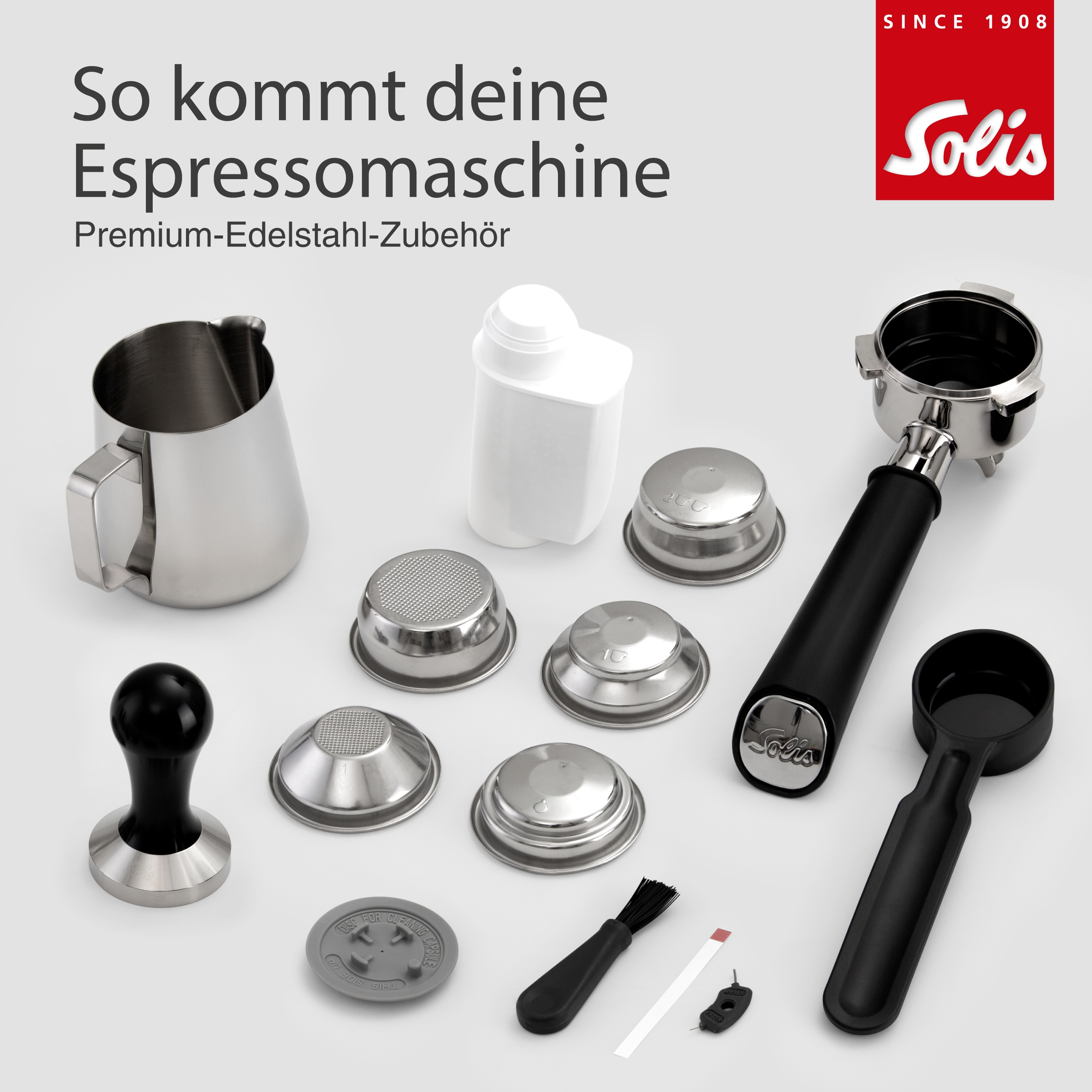 Edelstahl-Zubehör für Espressomaschinen: Kanne, Siebe, Tamper, Bürste.